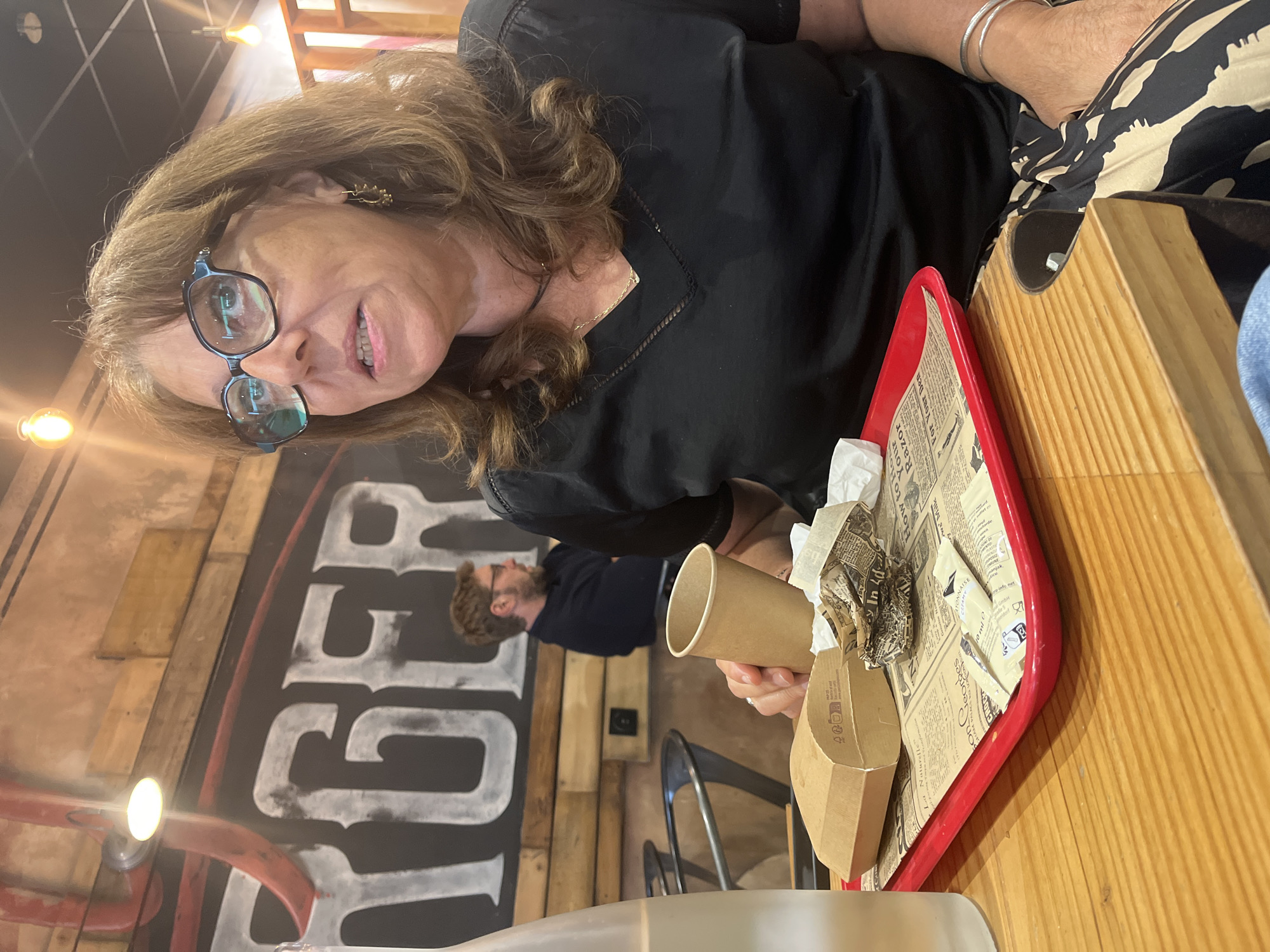 Woman dines at restaurant in Saint-Just-Saint-Rambert, France