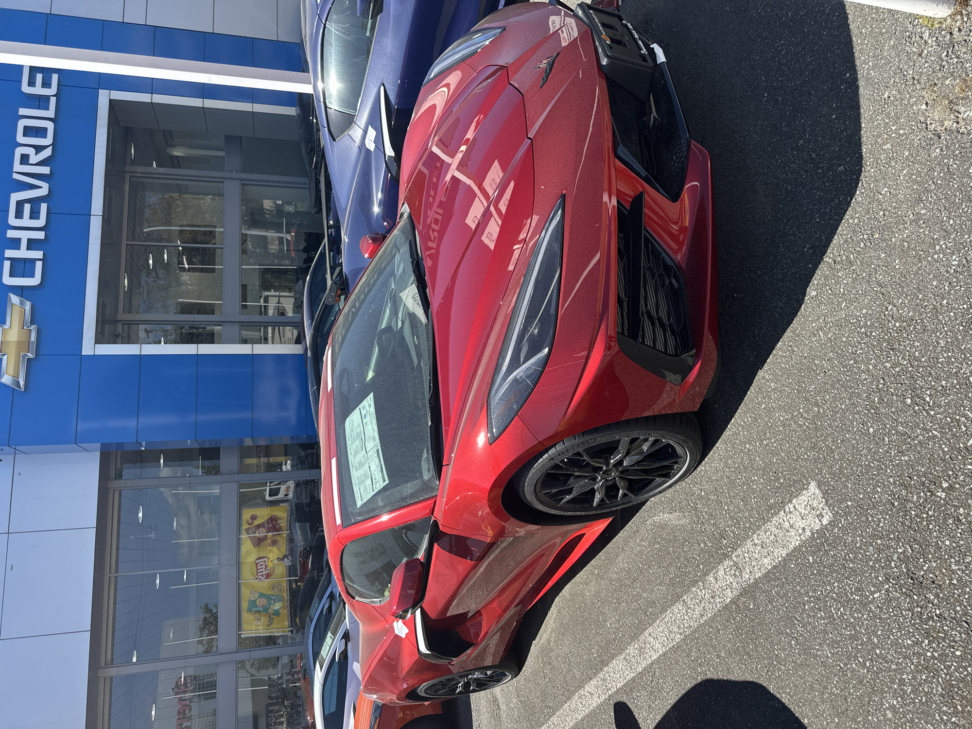 Colorful Corvettes gather at Surrey dealerships on sunny afternoon