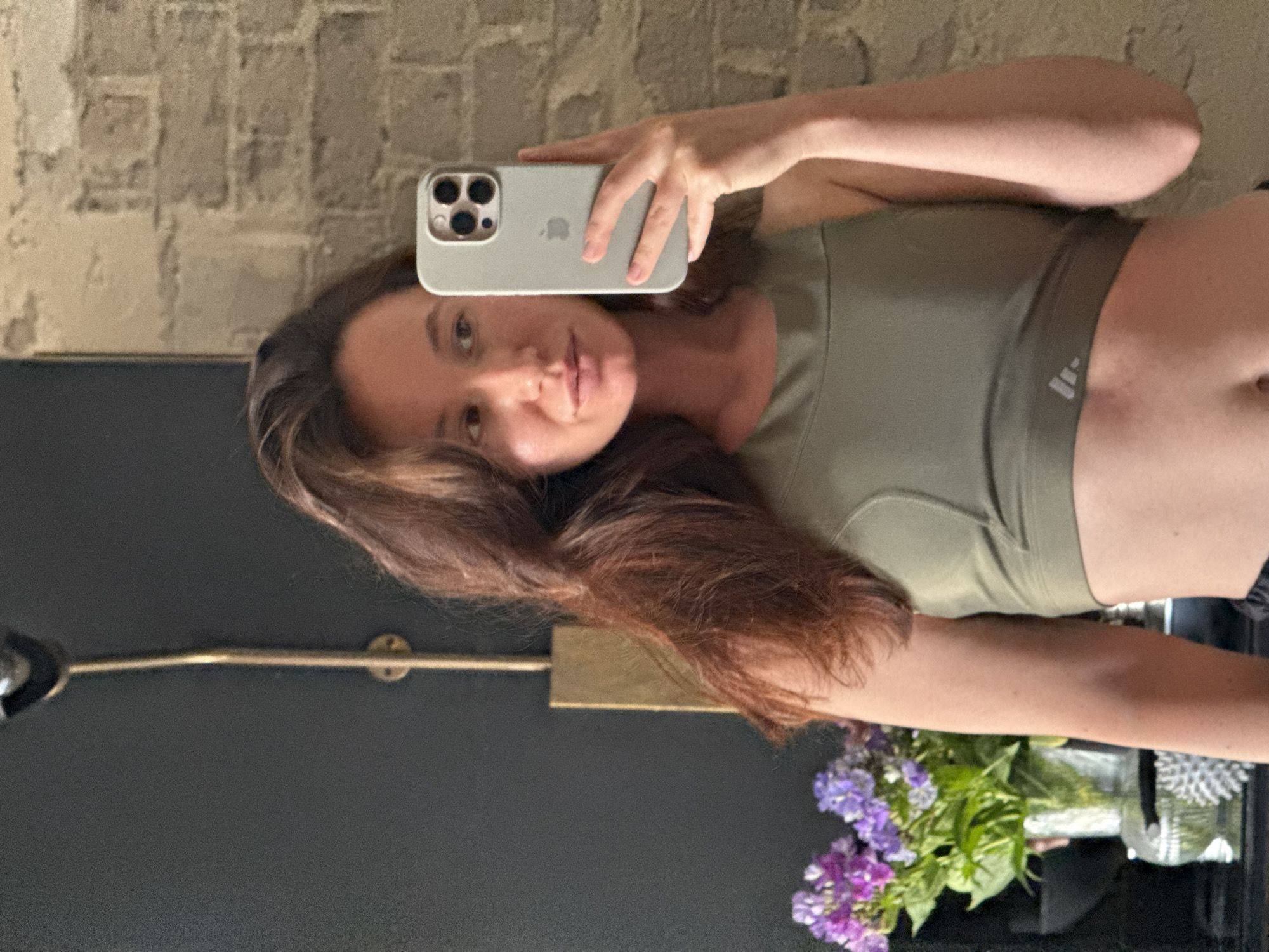 Woman takes mirror selfies in Tel Aviv apartment