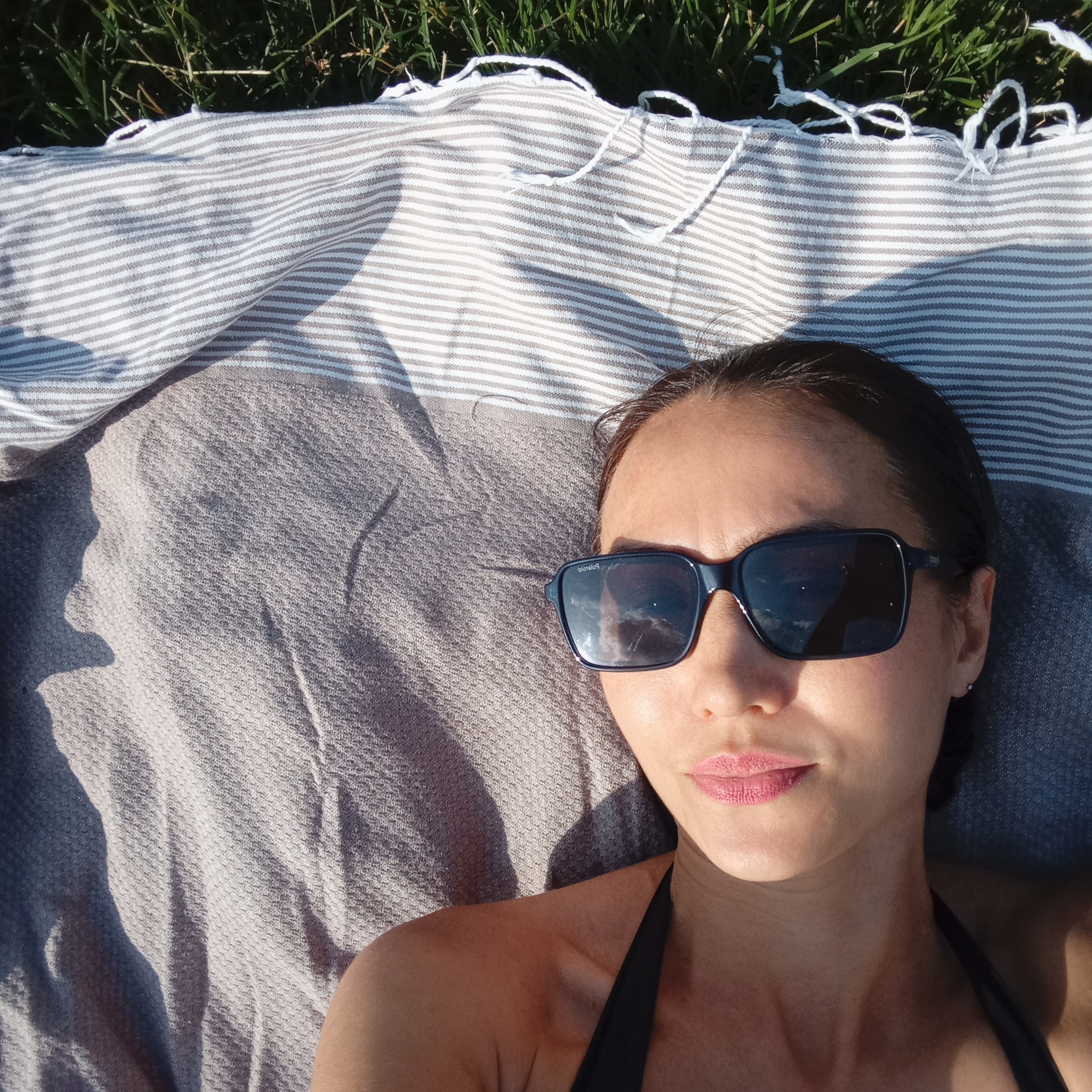 Lazy summer afternoon on the grass in Pervomaysky