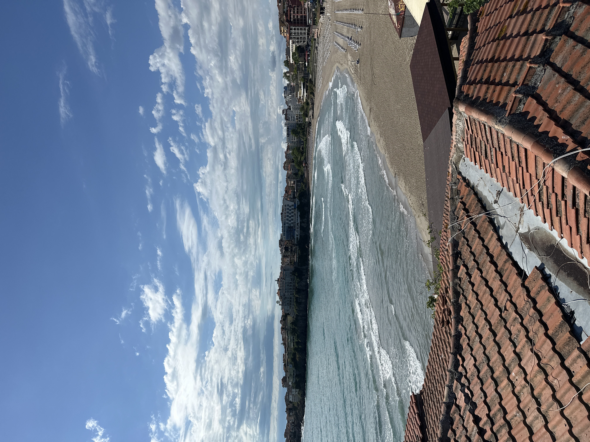Beach scene with clear skies and waves observed