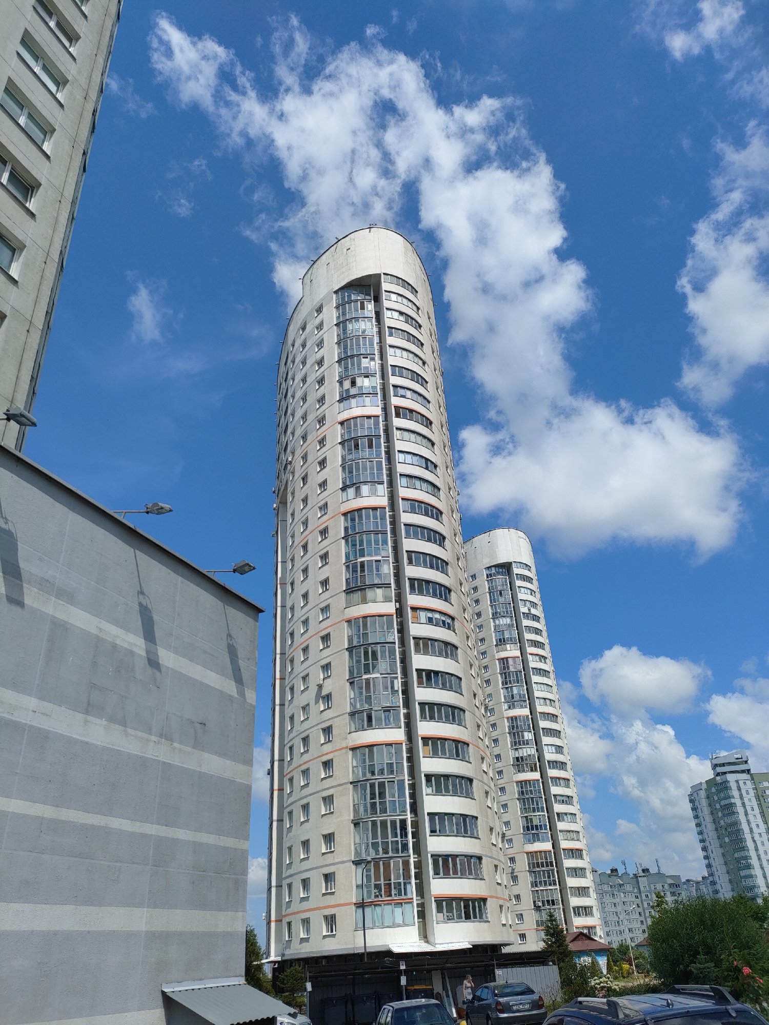 Modern high-rise residential towers under blue skies in Minsk