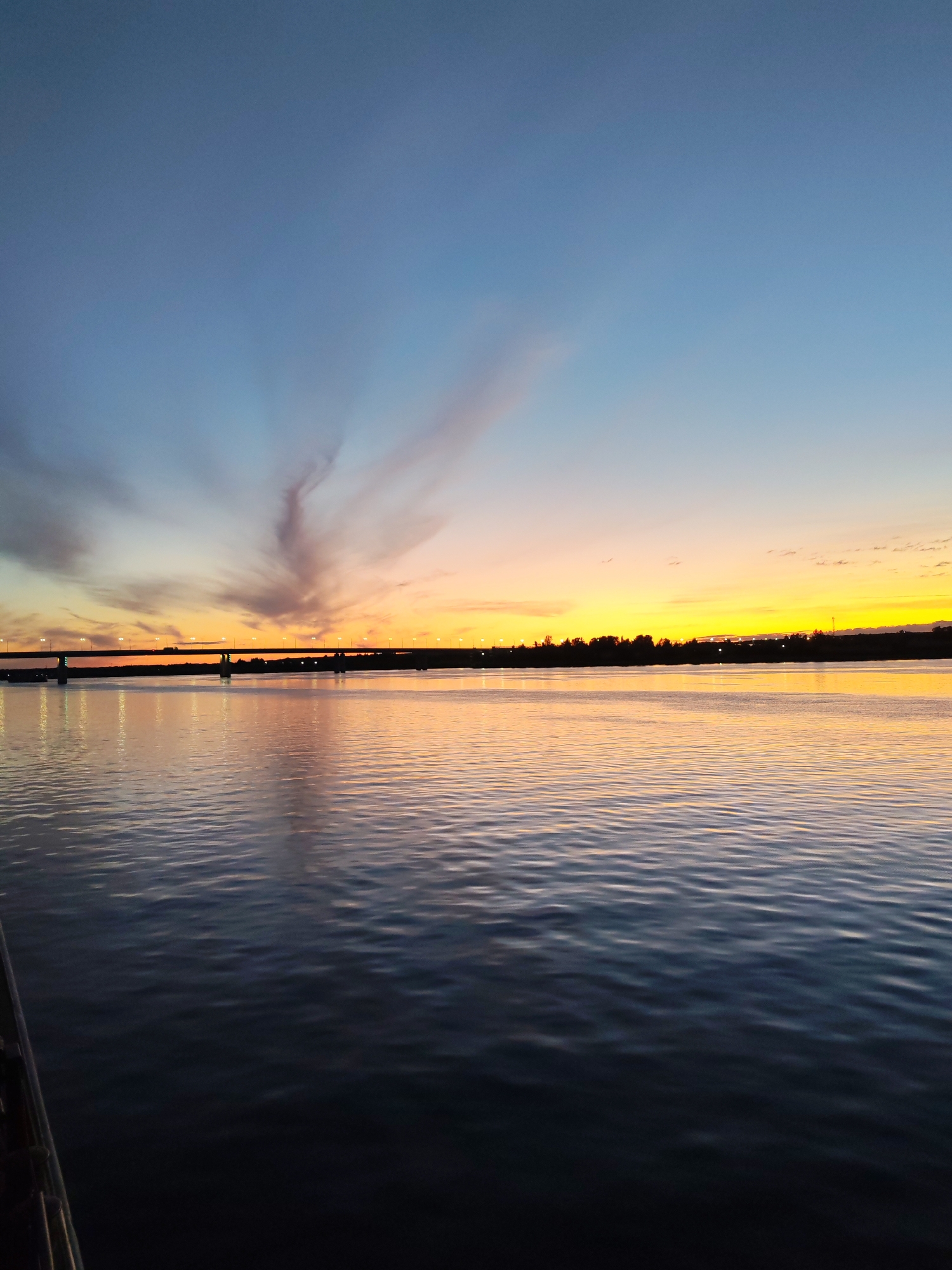 Golden sunset over the Volga, viewed from a river vessel