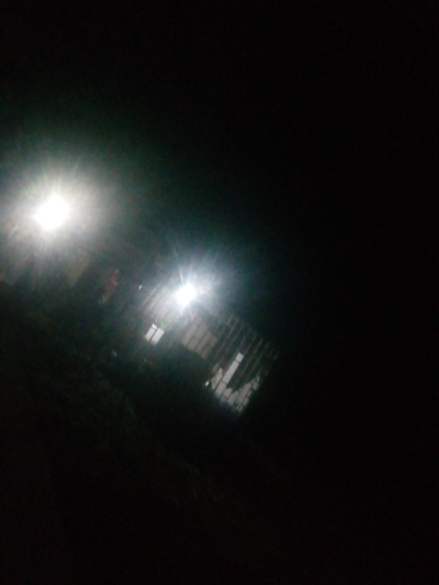 Night ride through Jalingo streets in a yellow auto-rickshaw