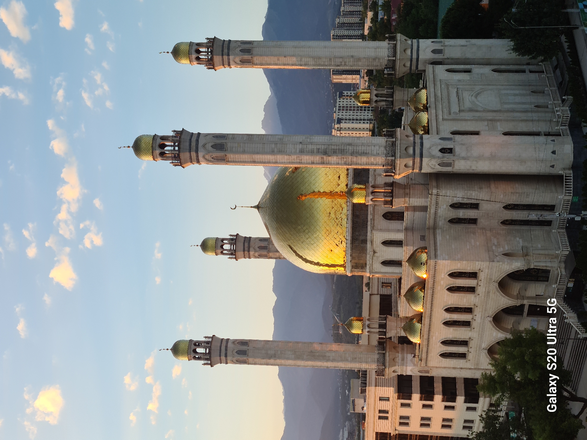 Almaty at sunset and moonrise, landmarks and skyline