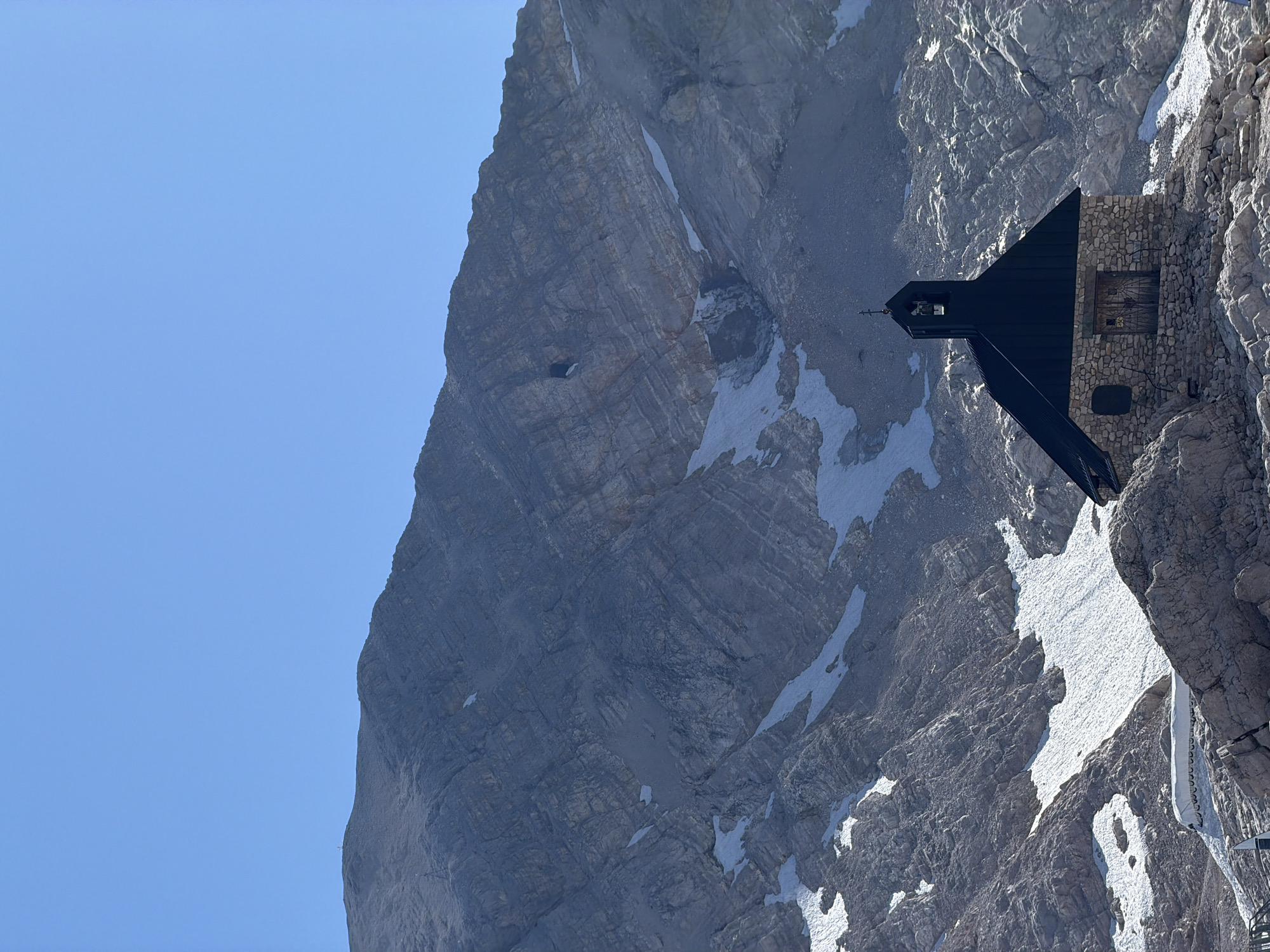 Summer day at a snowy Austrian mountain summit