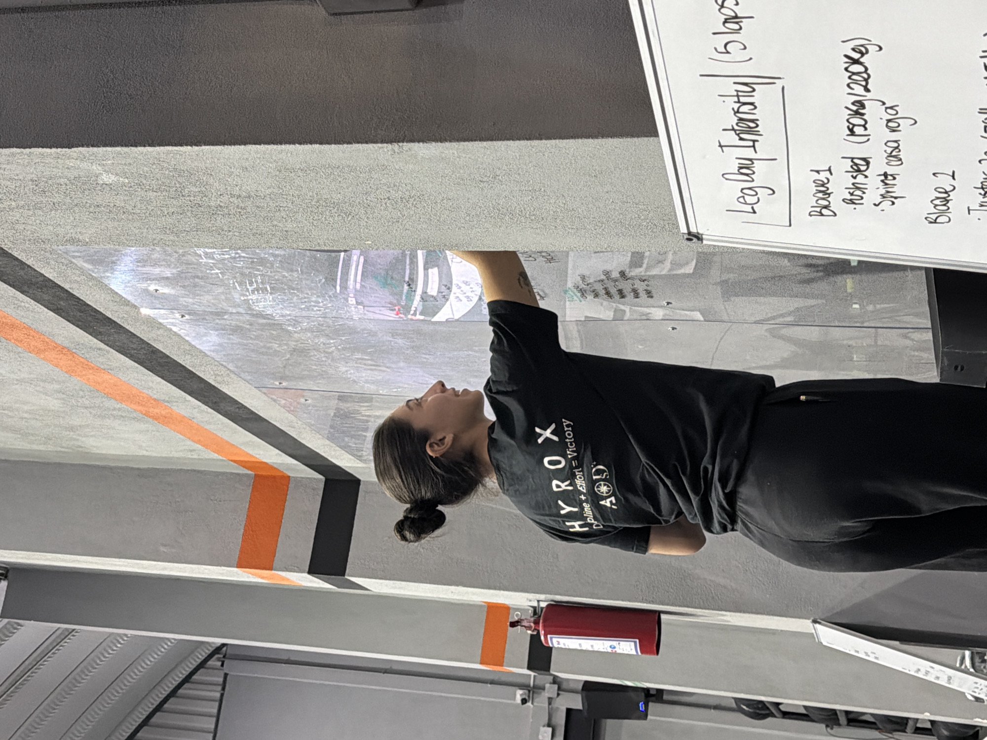 Woman studies workout routine at Mexico gym