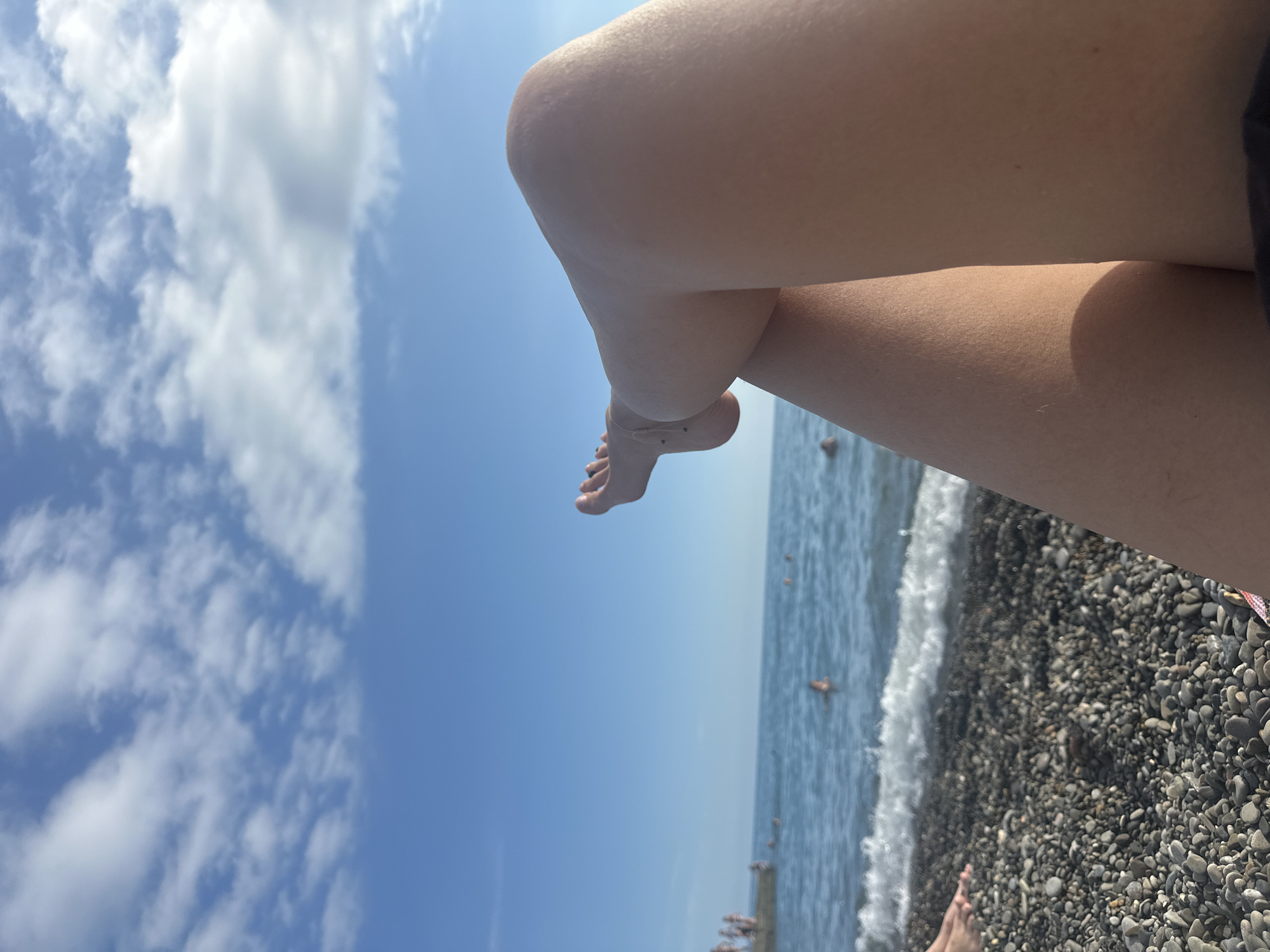 Relaxed summer afternoon on Sochi's Black Sea pebble beach