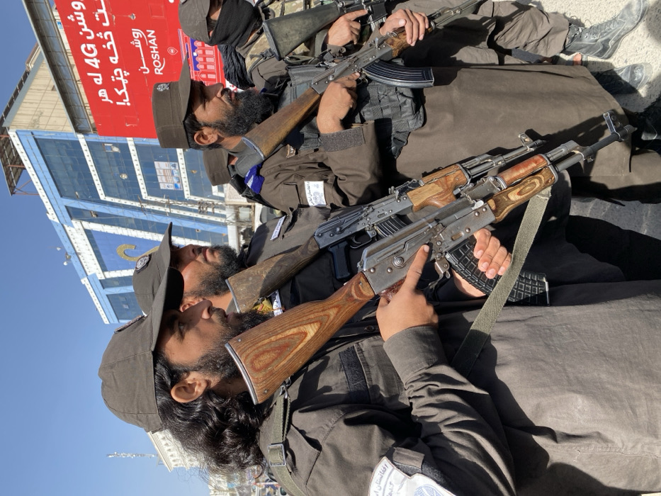 Armed uniformed personnel patrol Kandahar streets in formation