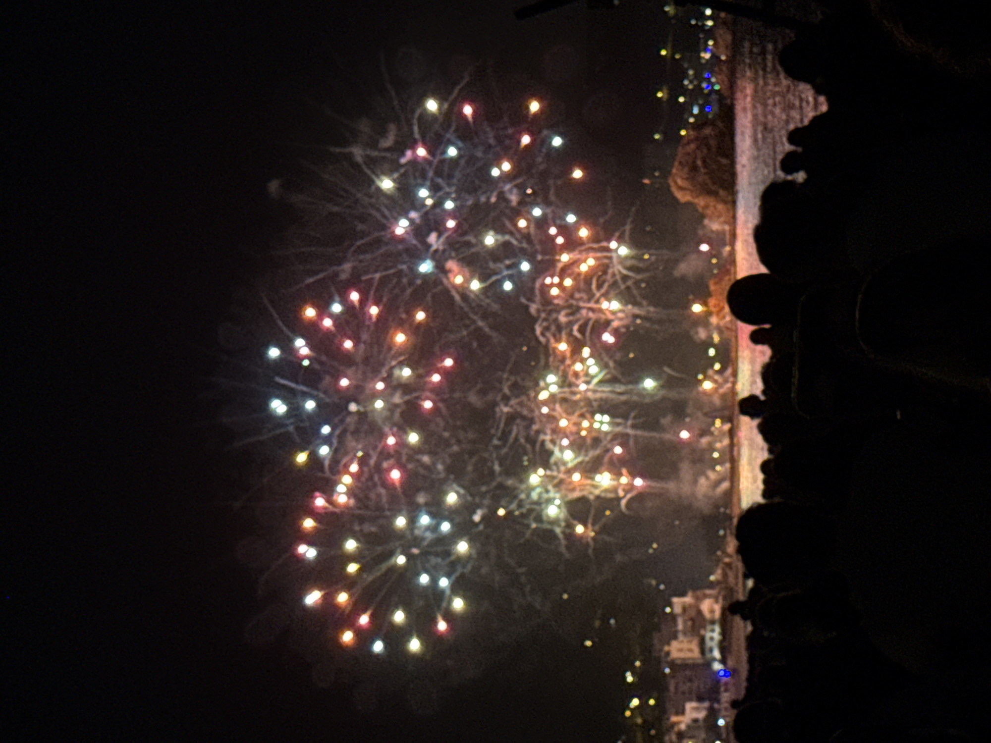 Fireworks display over the water draws crowds to Blanes beach