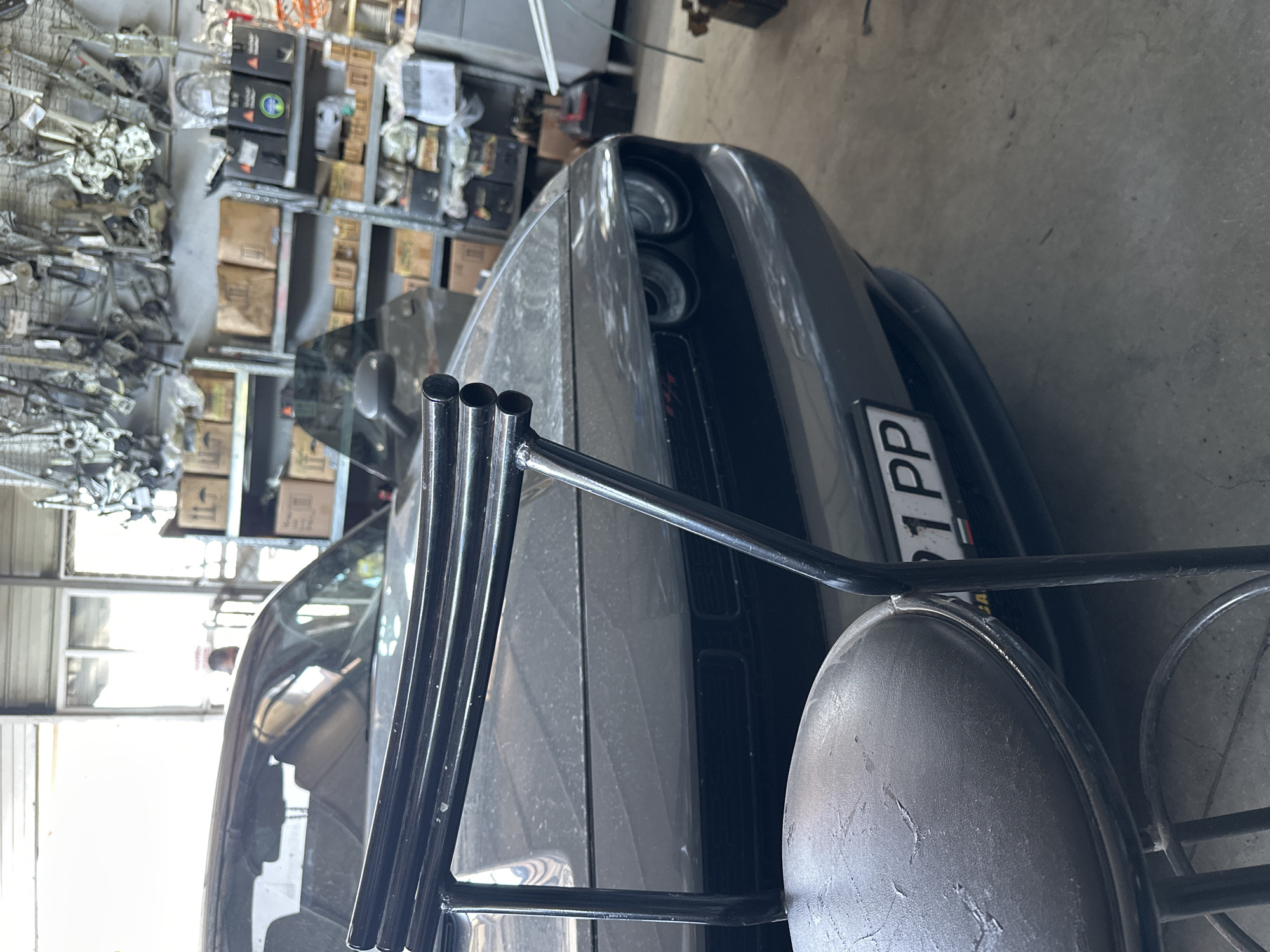 Gray Dodge Challenger in garage from multiple angles