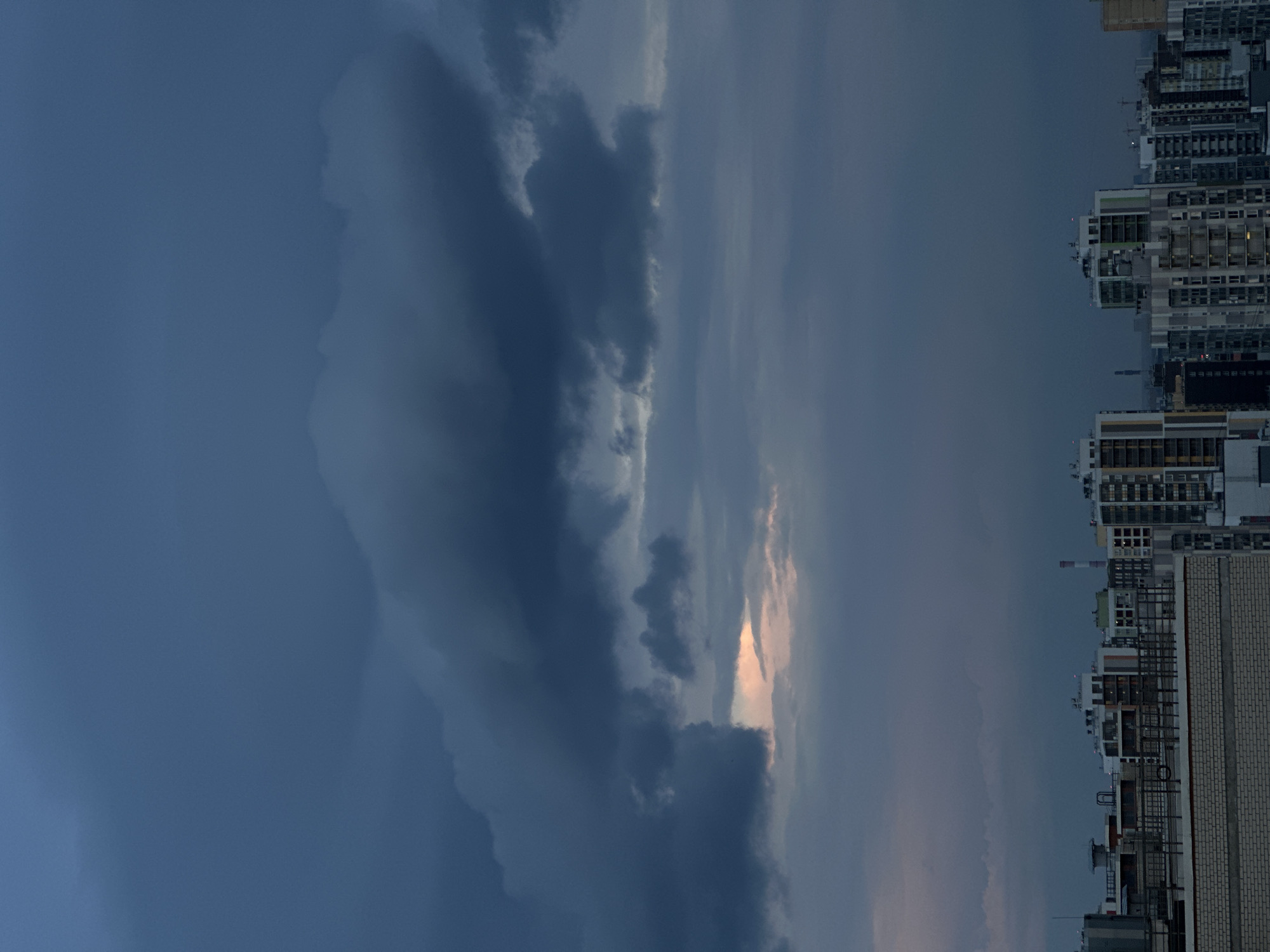 Russian apartment skyline at dusk, clouds and fading light