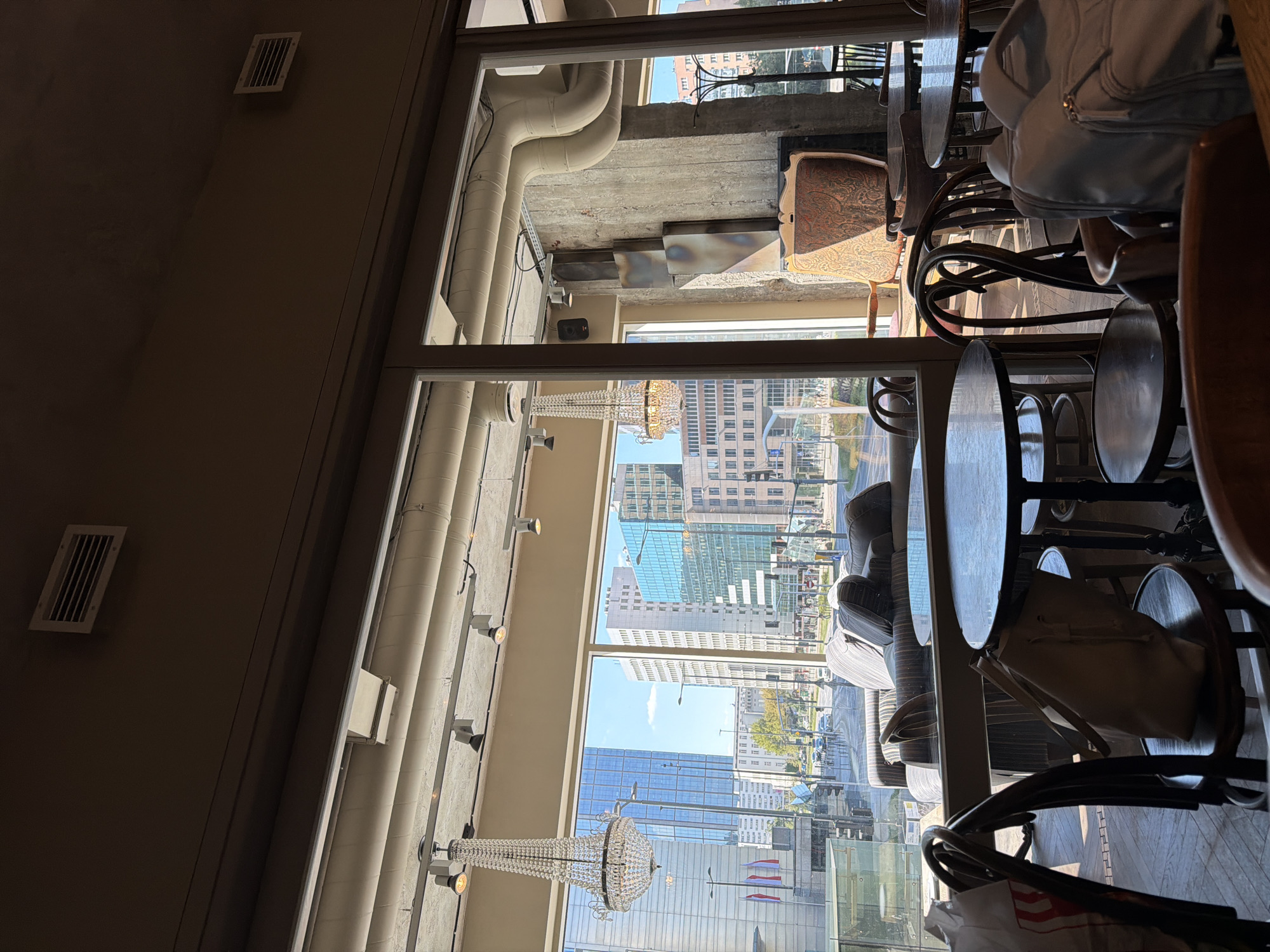Meringue cake and coffee at a Warsaw café window seat