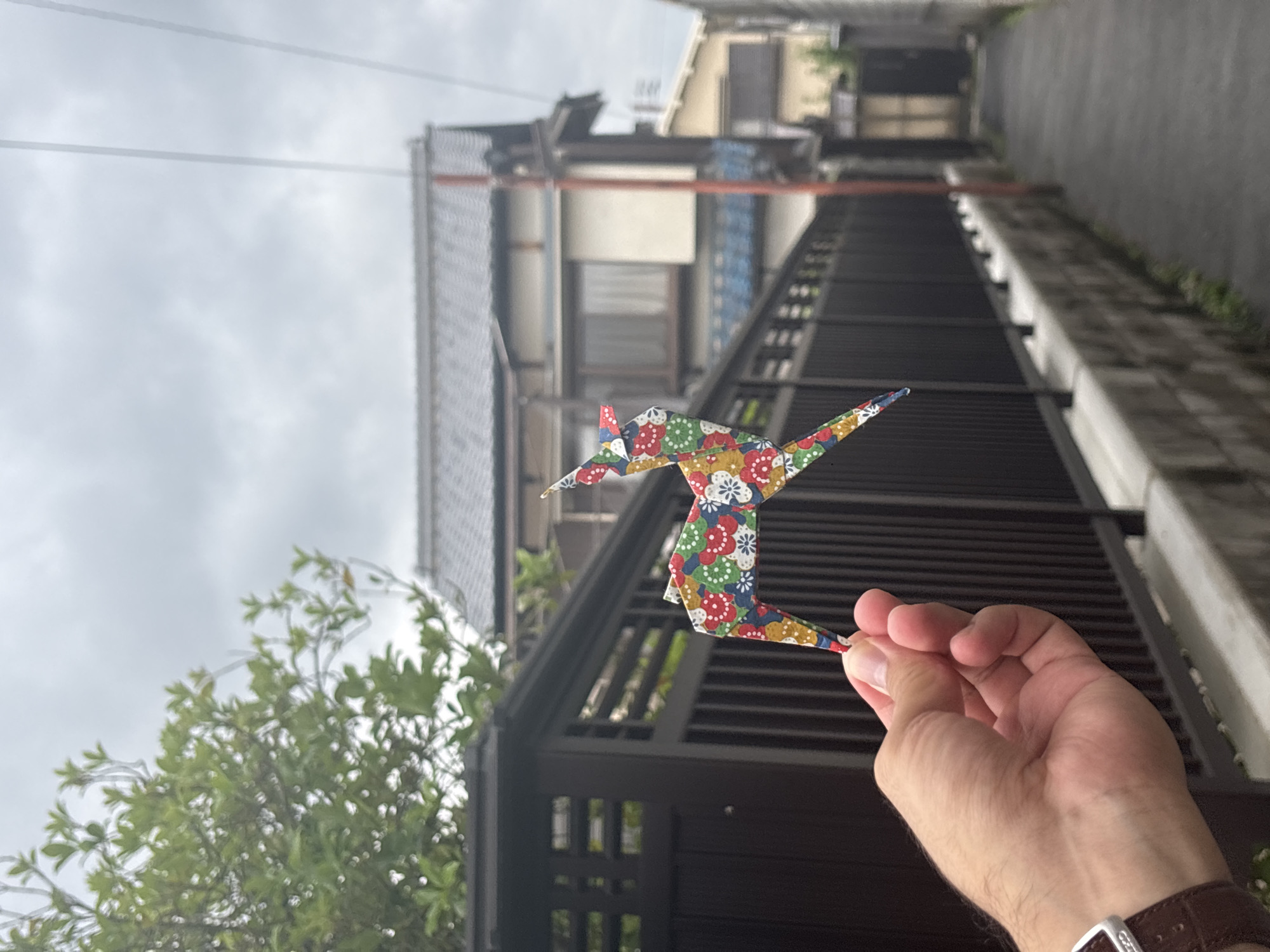 Origami crane displayed on residential street in Nara