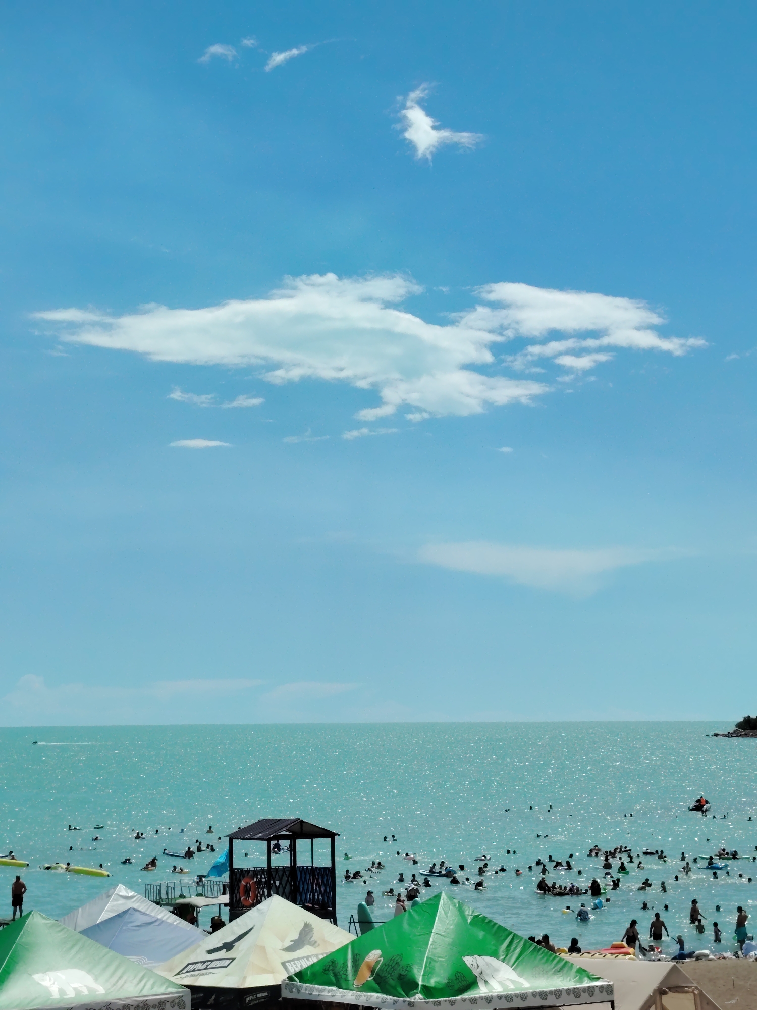 Sun, rain, and parasails over Lake Balkhash in Kazakhstan