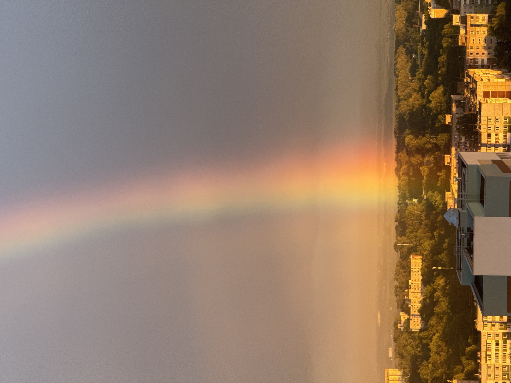 Rainbow and sunset light up Perm's skyline on a dramatic evening