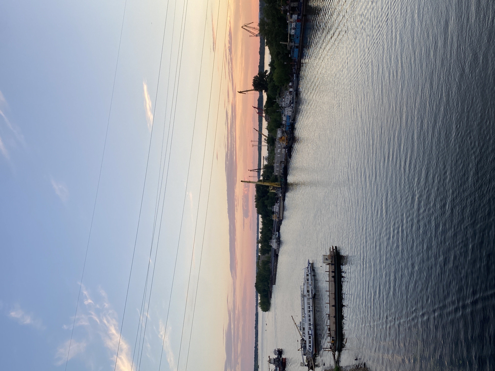 Summer evening on the Volga: river, boats, and dusk over Novokuybyshevsk