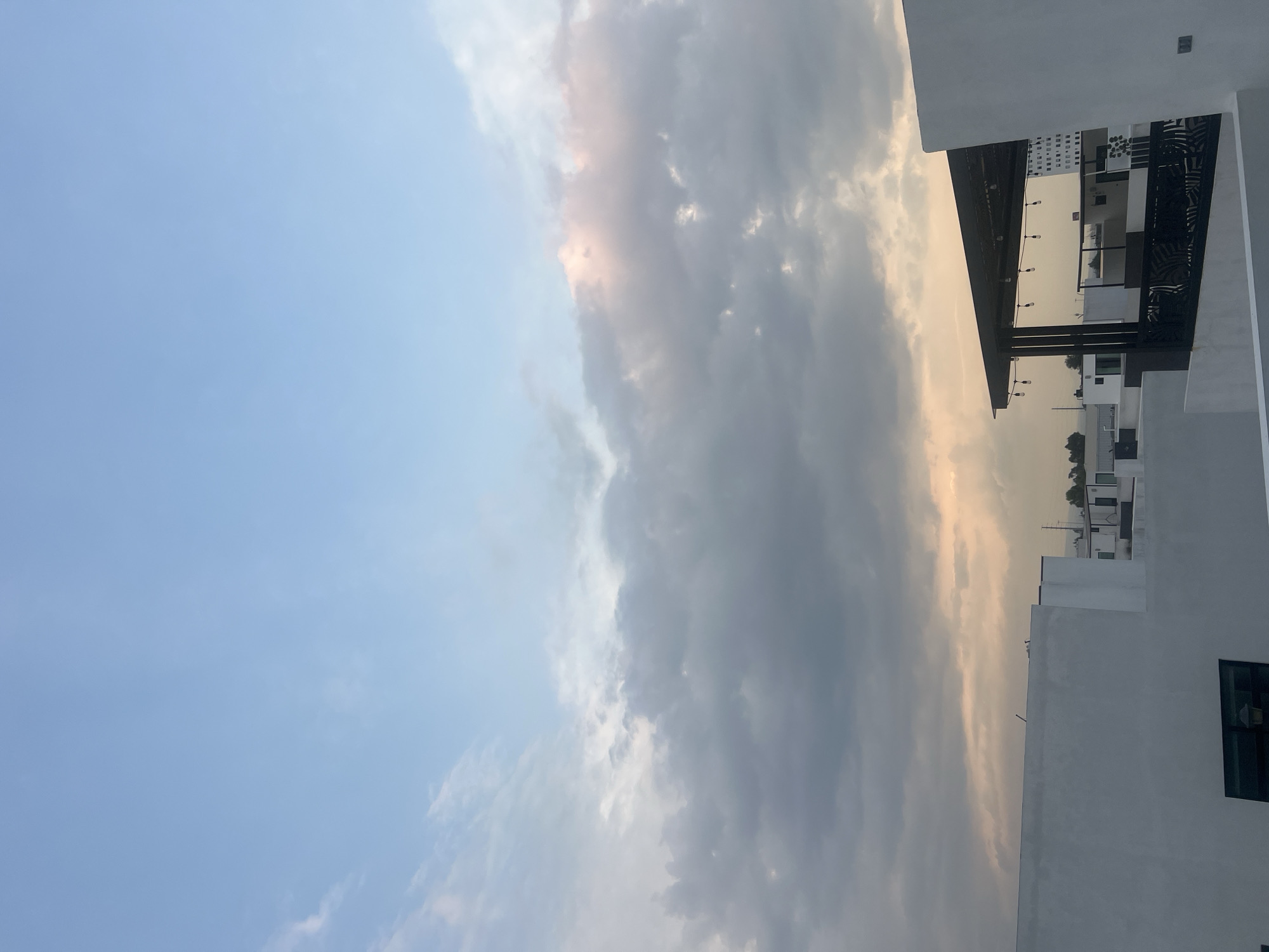 Witness documents cloudy sky, modern building in Cholula, Mexico