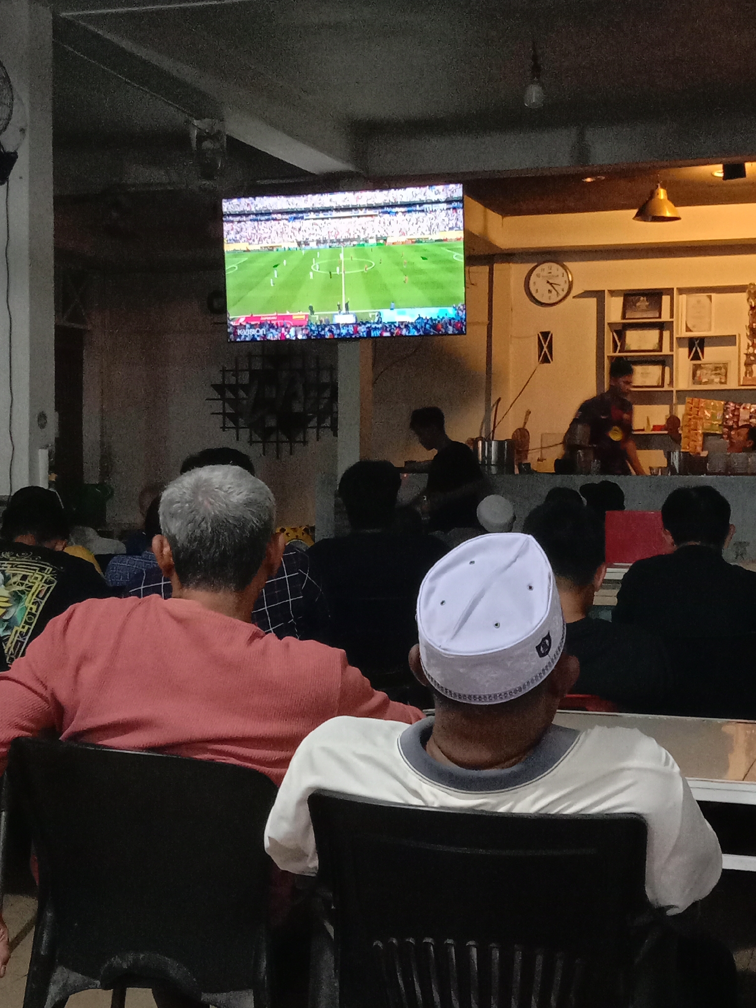 Football night at a Lhokseumawe warung kopi