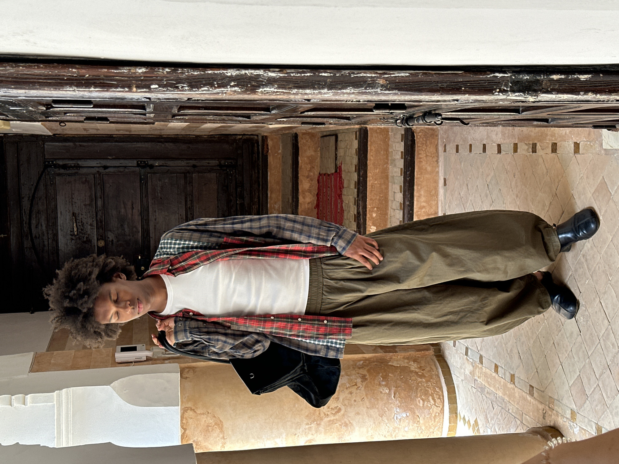 Young man observed in tiled building in Marrakesh