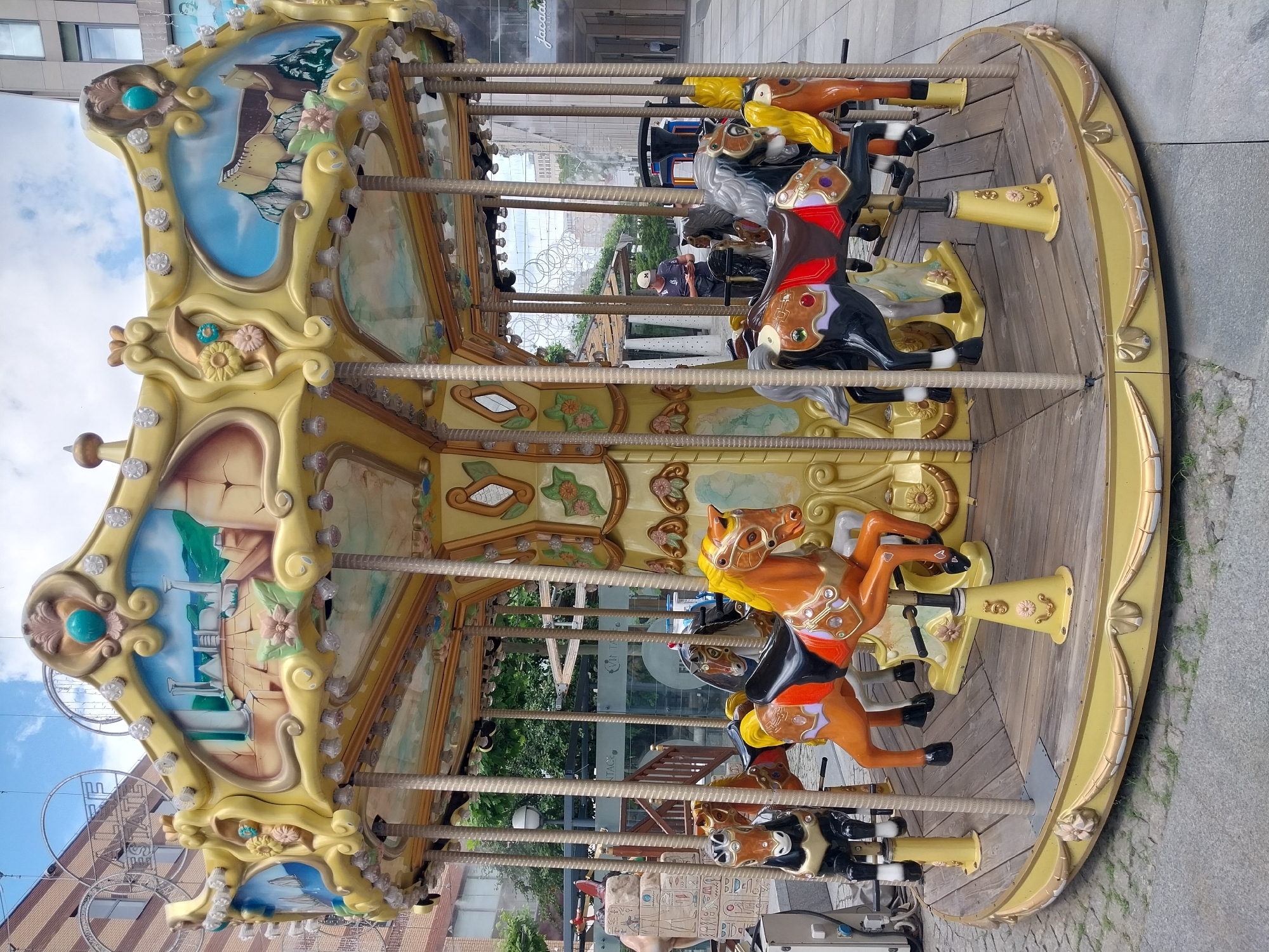 Dnipro plaza buzzes with fountains, carousels, and street life