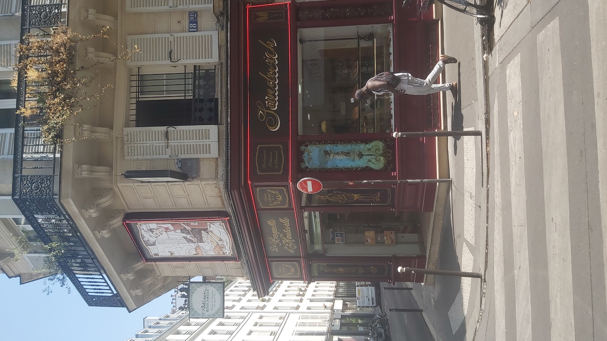 Cafés, bakeries, and classic facades on a Paris afternoon