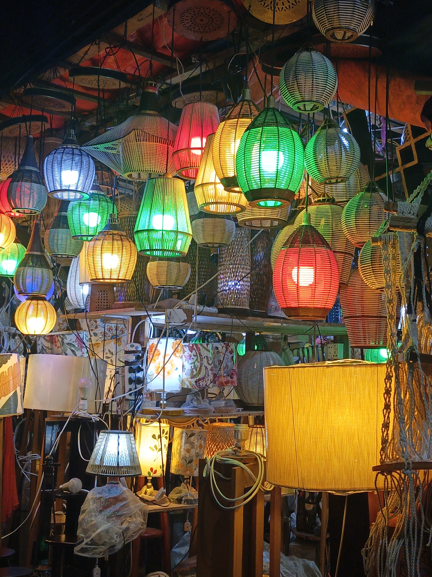 Colorful handicraft market stall bustles with handmade lamps in Dhaka