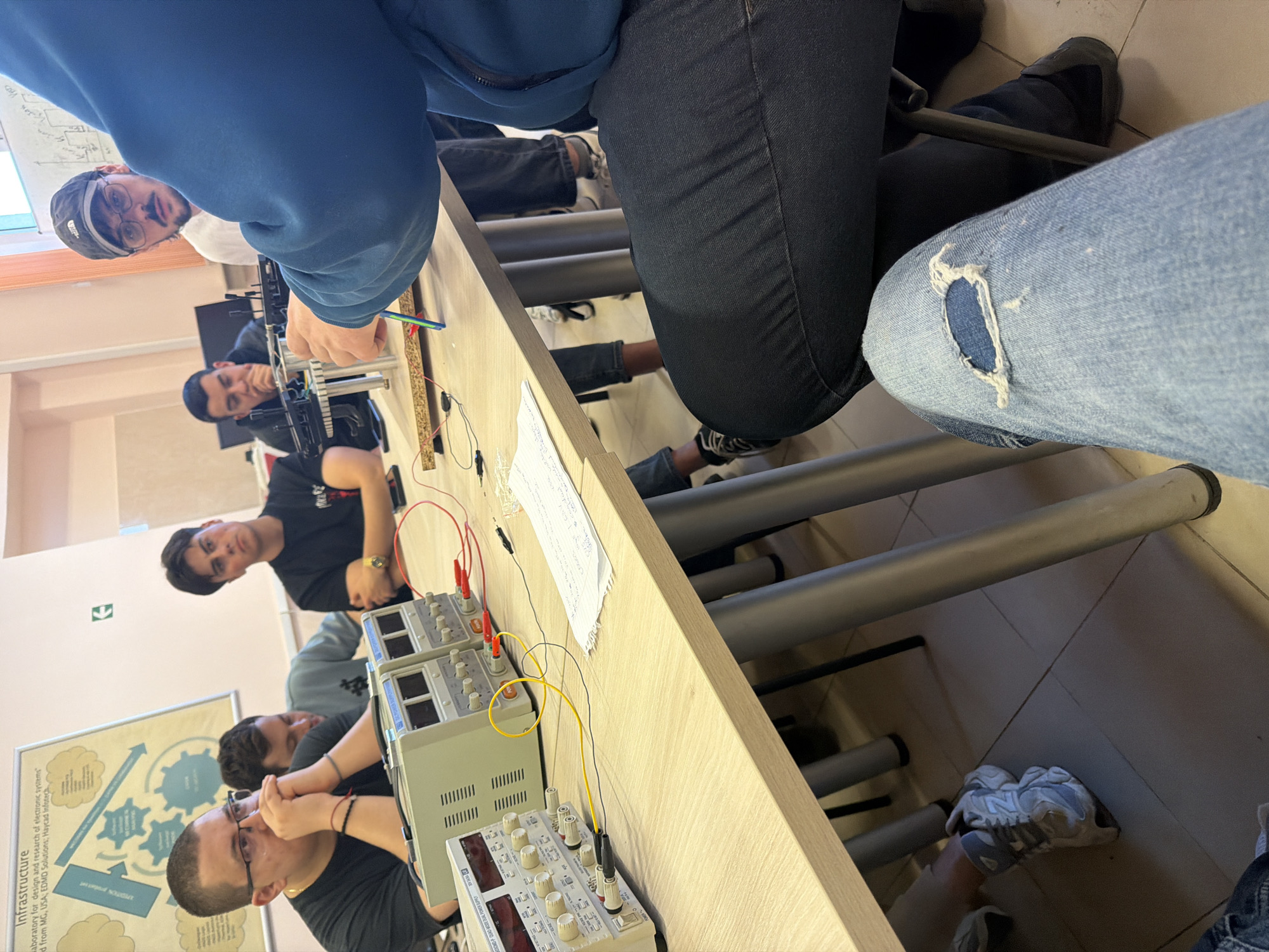 Students conduct electronics experiment in classroom laboratory