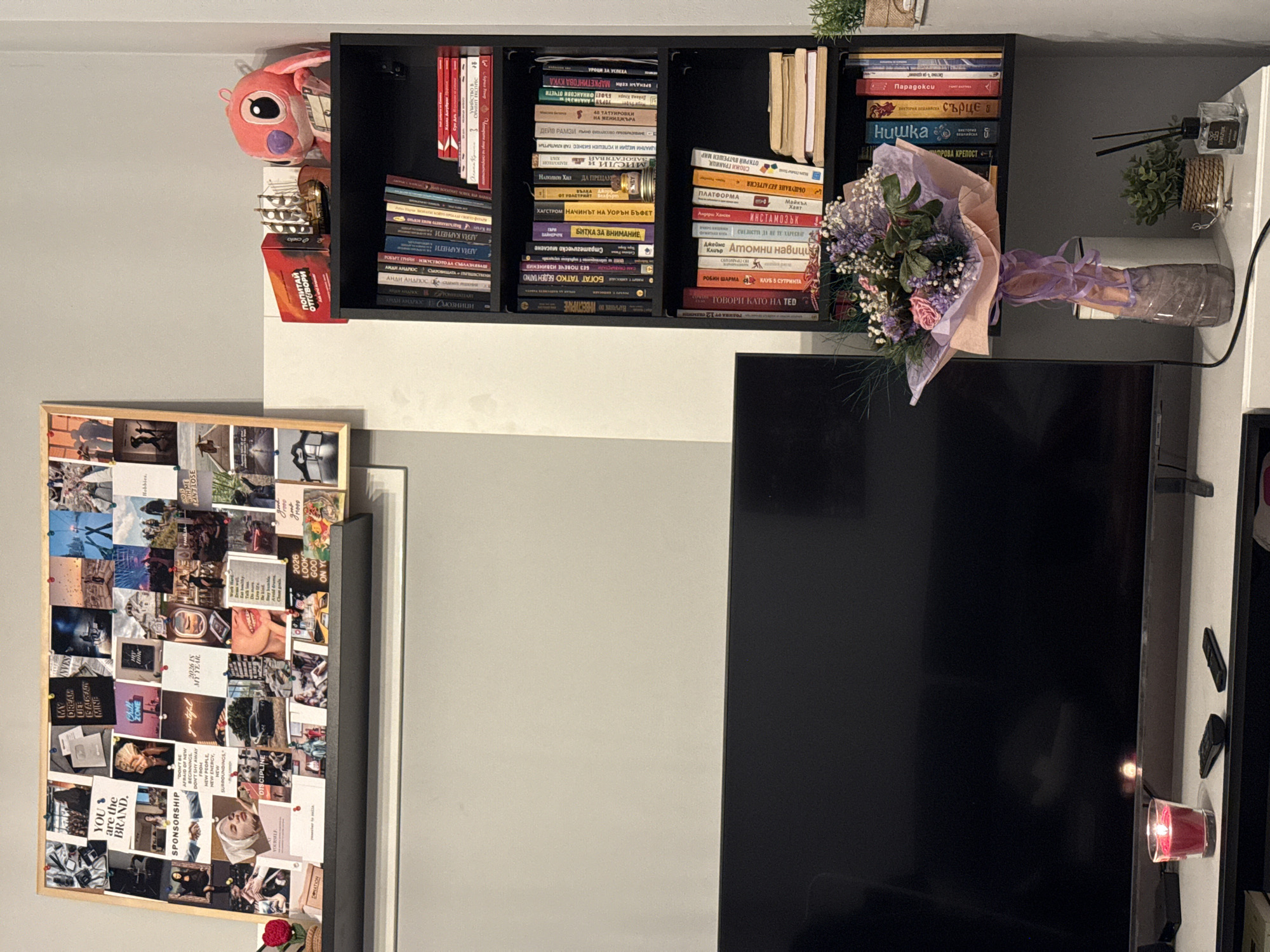 Indoor apartment scene captured in Sofia with bookshelf and laptop