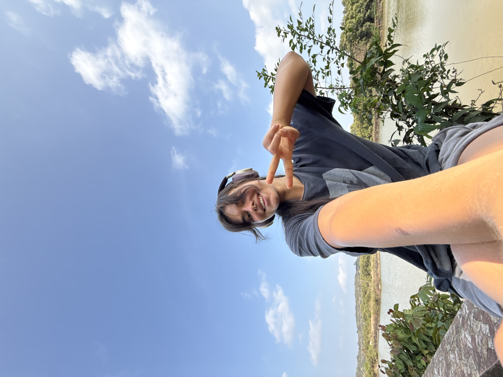 Person takes selfie in sunny residential area in Marra