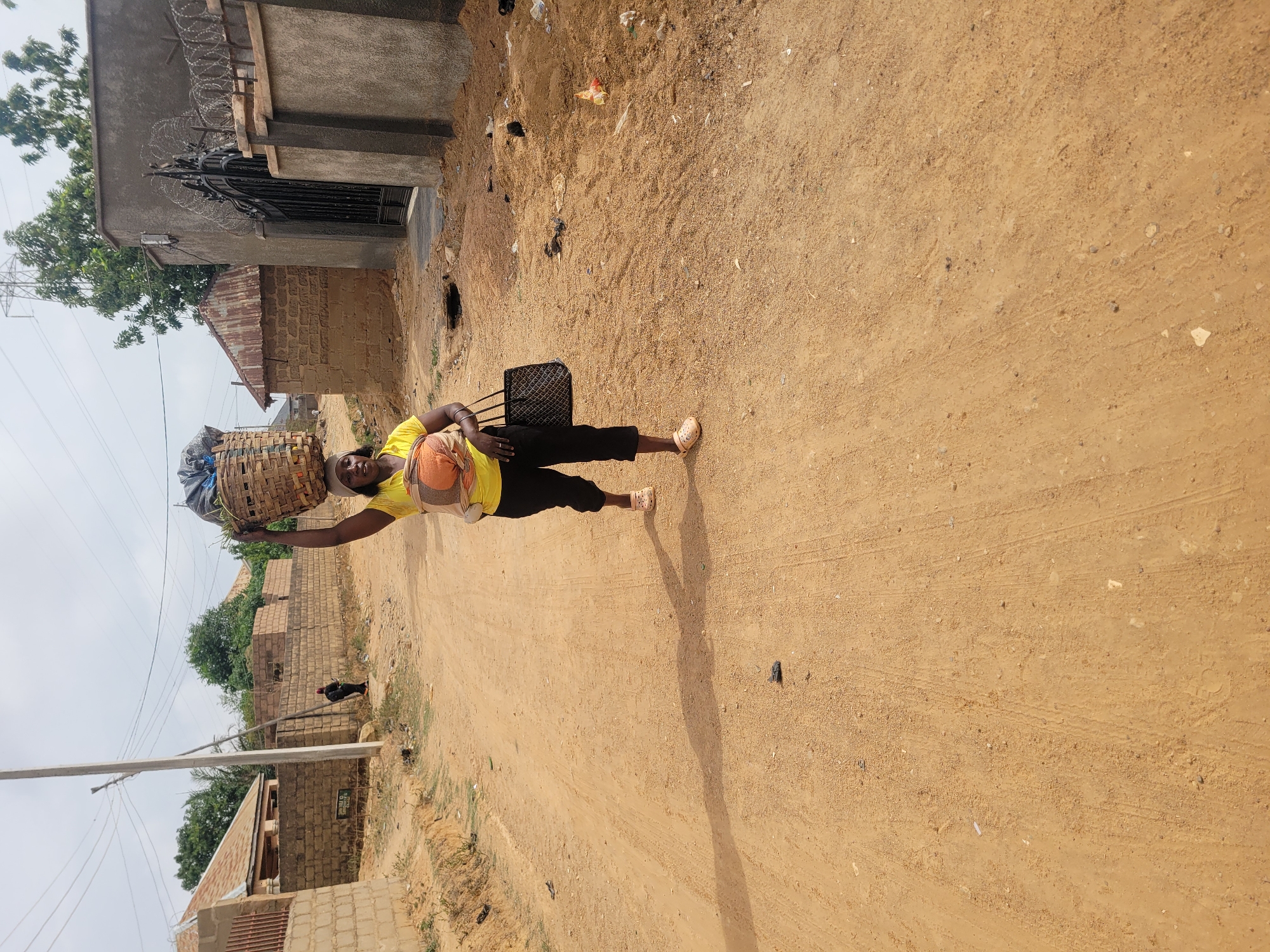 Morning routines captured across Nigerian communities include water collection, walking