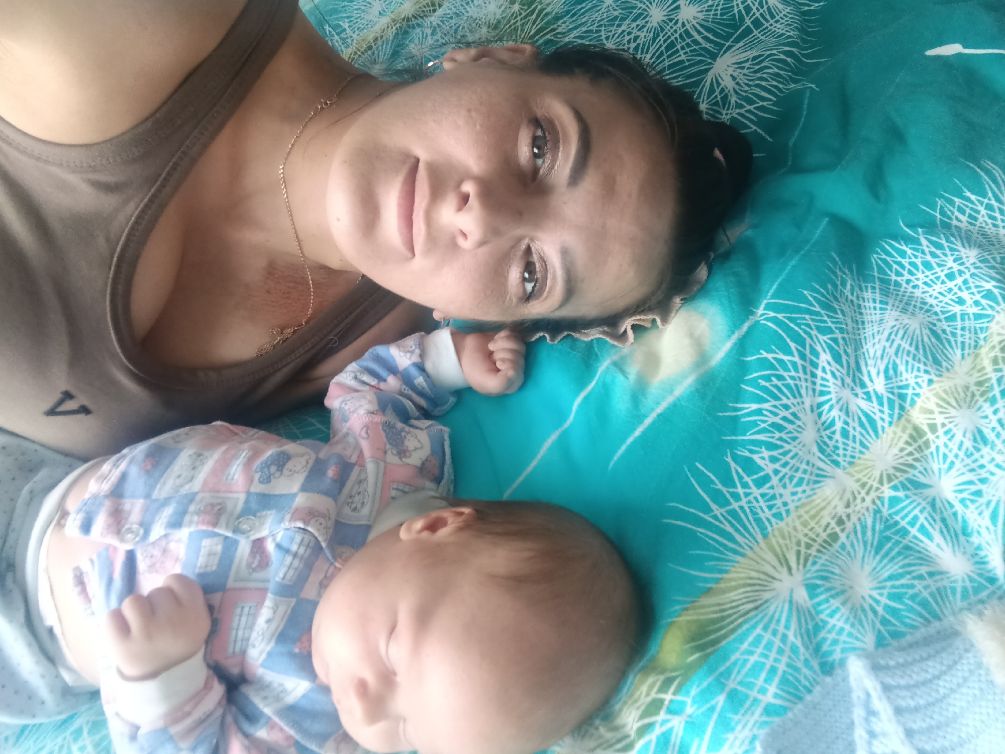 Mother and baby share quiet moments in Andreyevo home