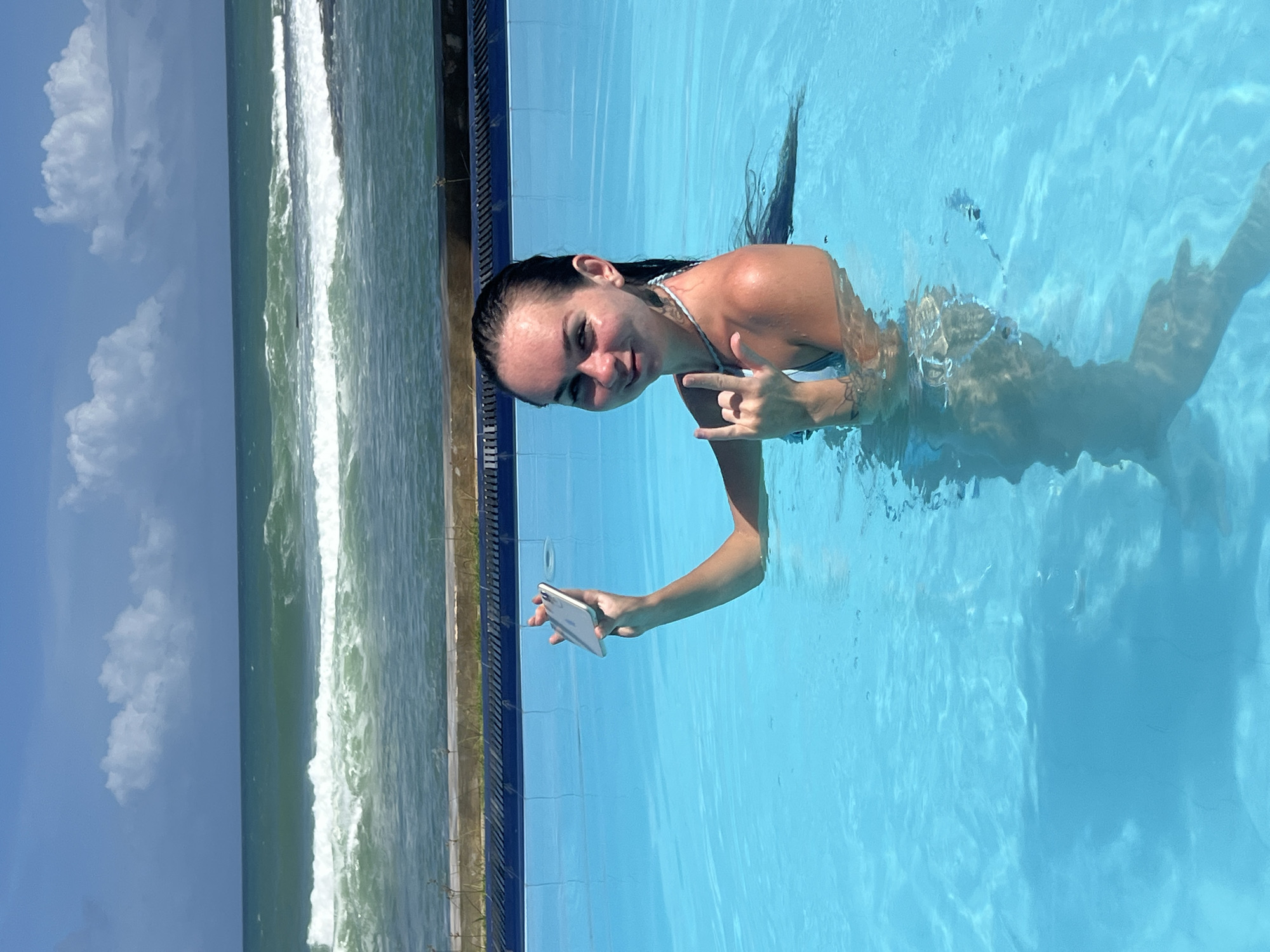 Woman poses for selfies in pool near Sri Lankan coast