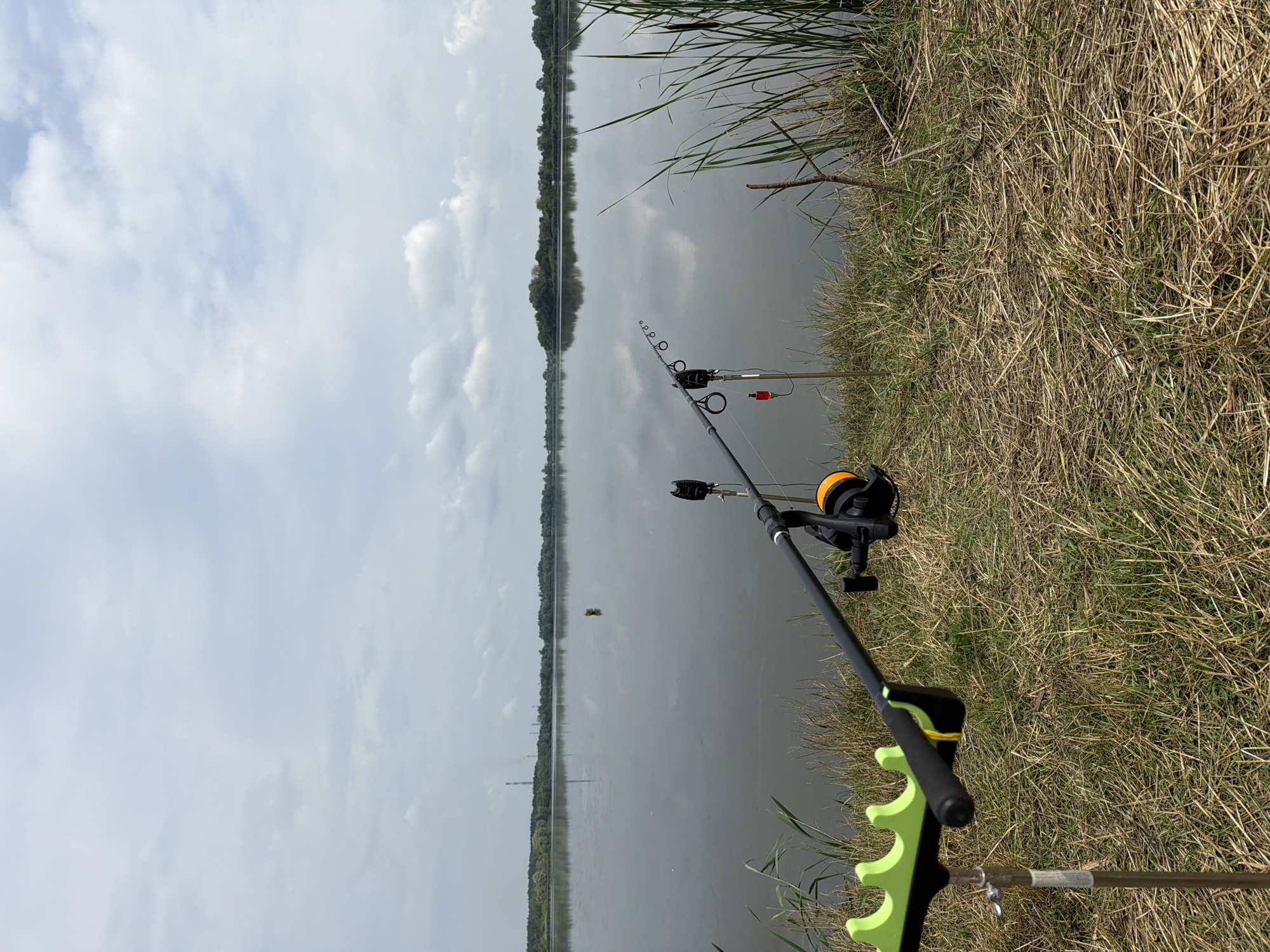 Fishing camp set up along a calm Ukrainian riverbank