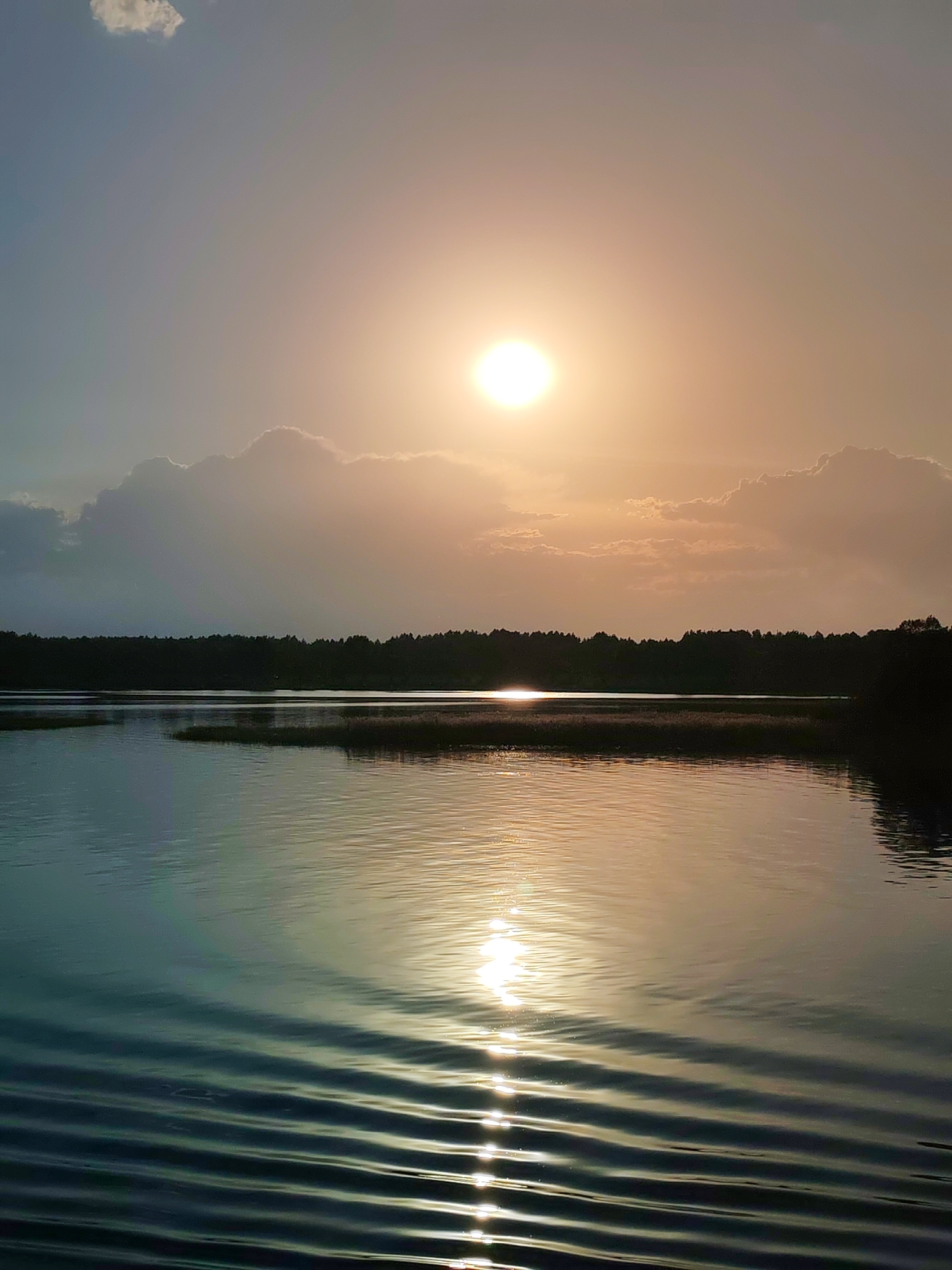Golden afternoon light captured over tranquil waters in Russia