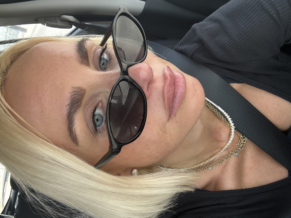 Blonde woman photographed in vehicle in Dubai