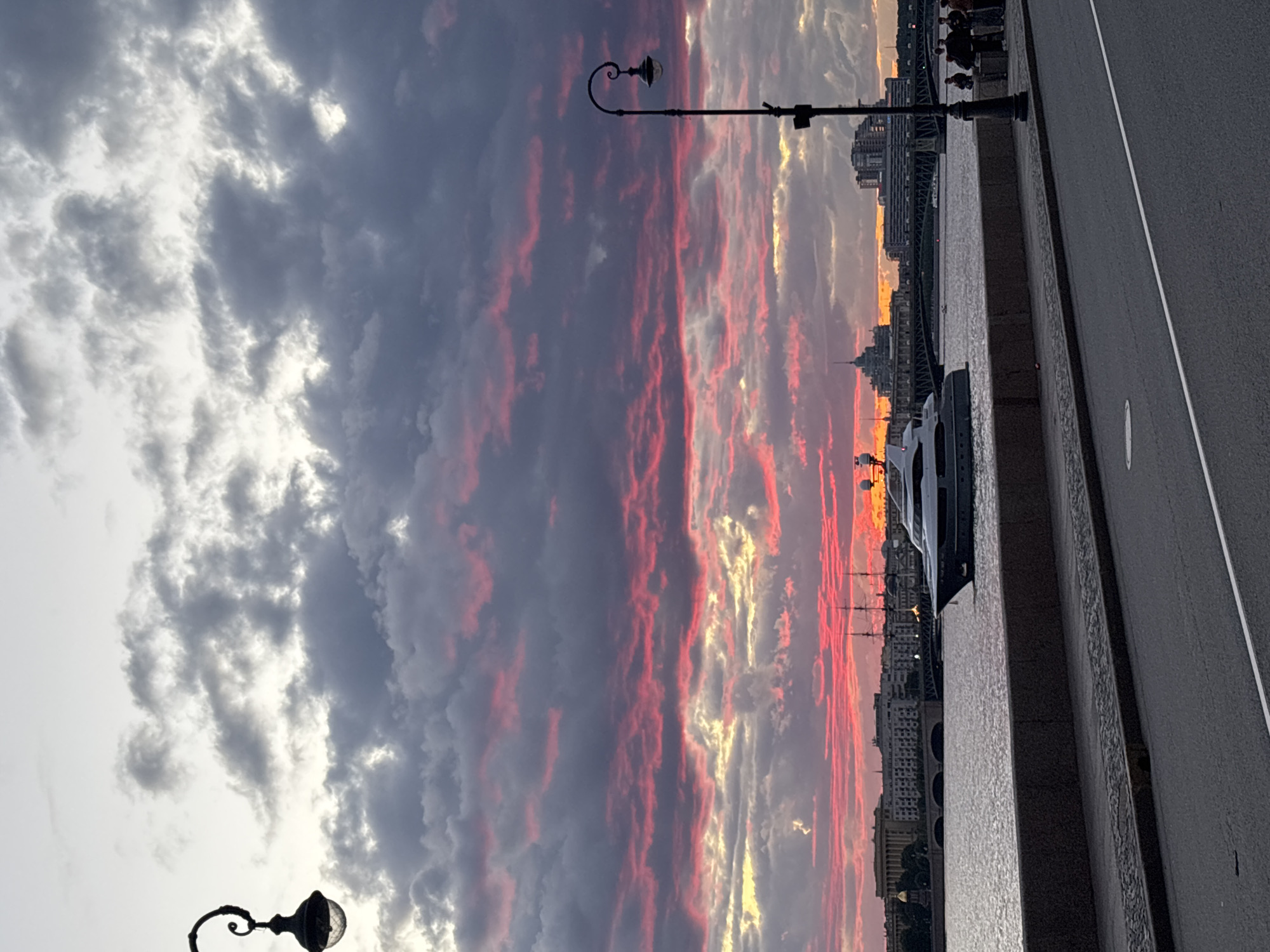 Saint Petersburg's Neva River glows through a dramatic summer sunset