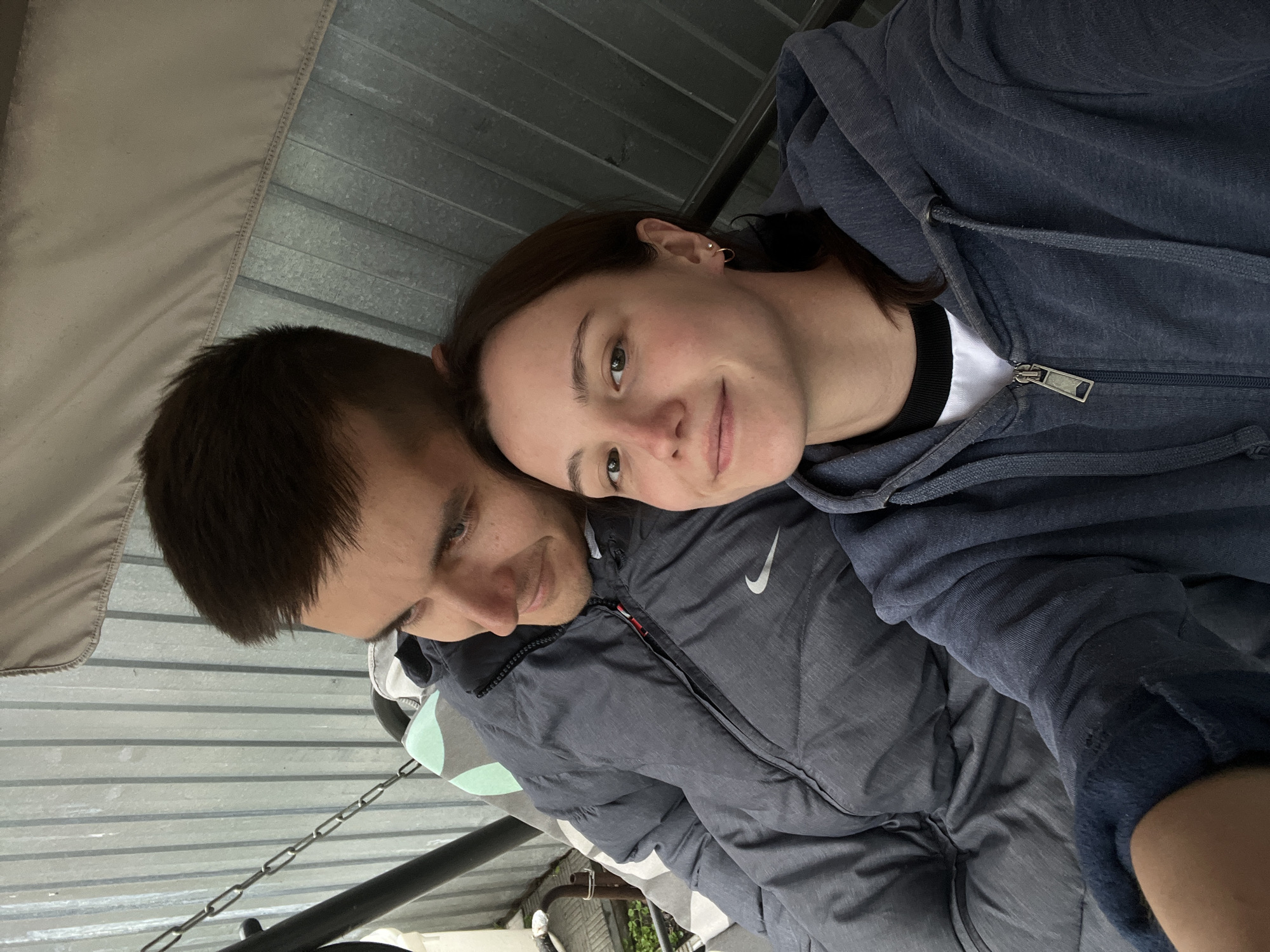Couple documents leisurely afternoon with cats in Novocheremshansk