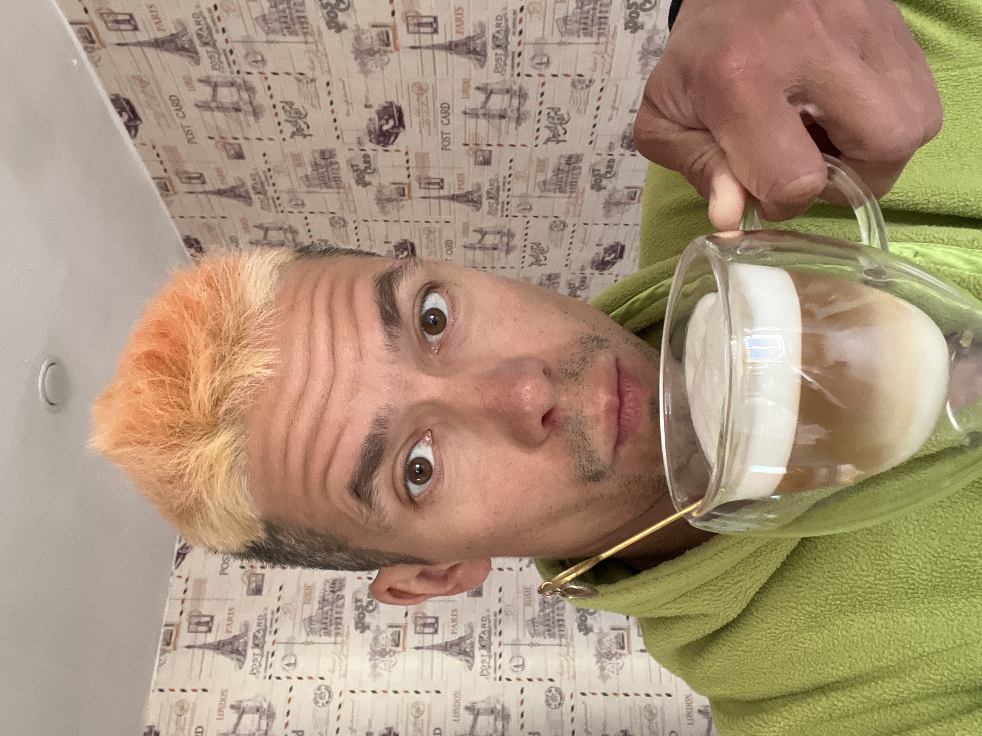 Man in bathrobe holds coffee pitcher in Chaikovsky home