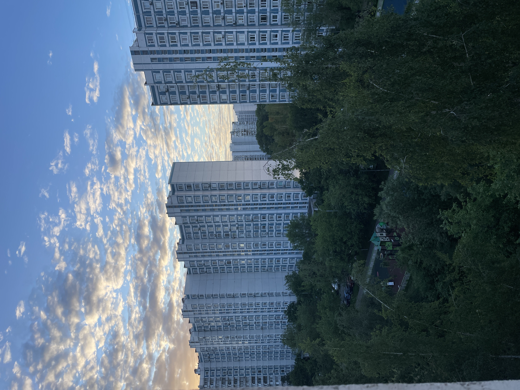 Dusk clouds photographed over Moscow residential area