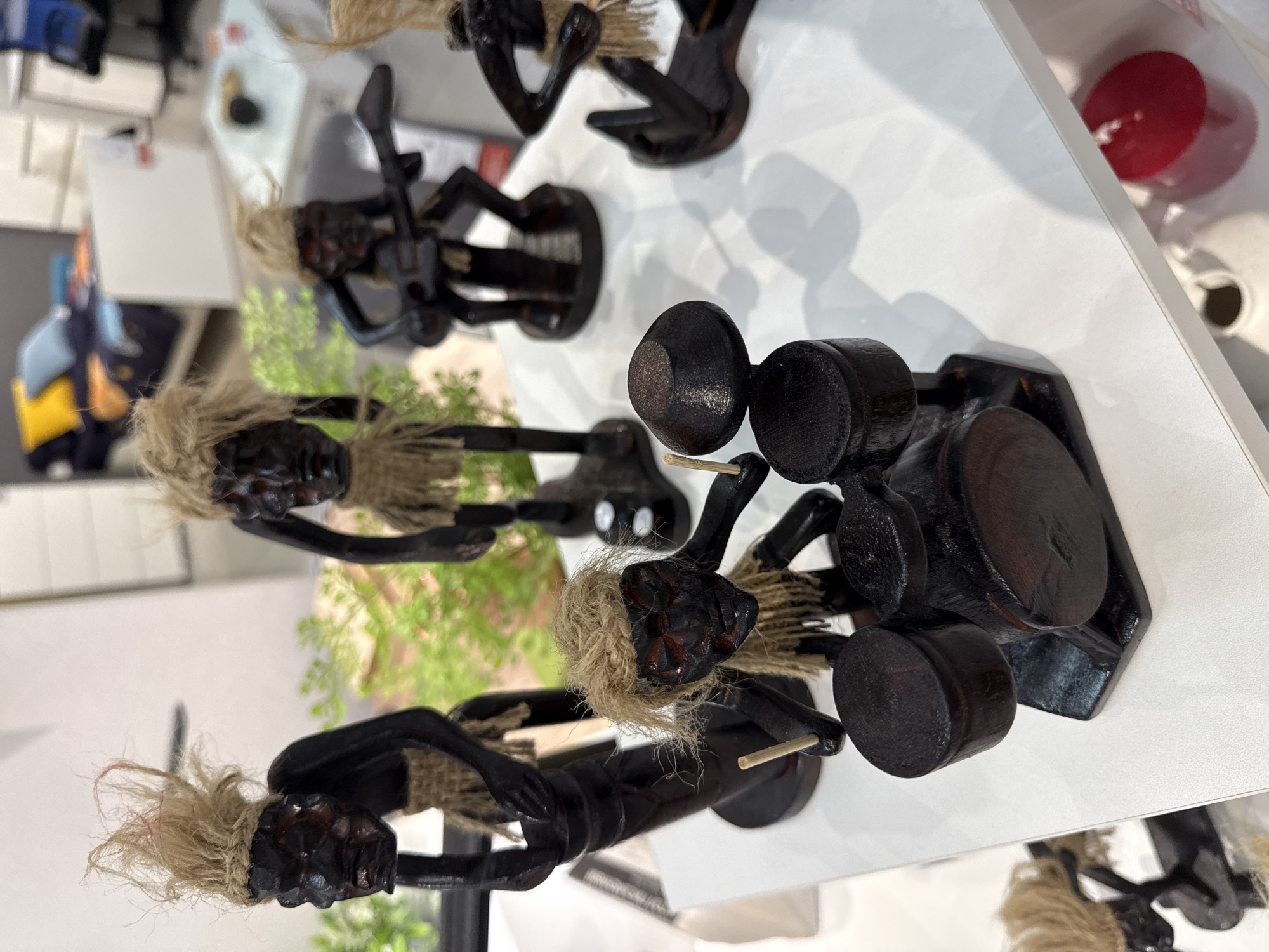 Wooden musician figurines displayed on shelf in Perm, Russia