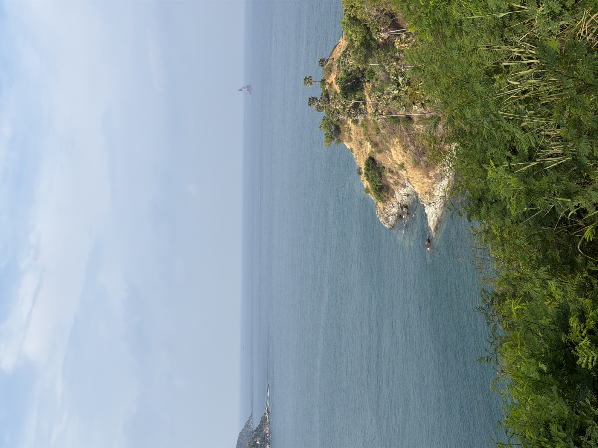 Hazy ocean view captured from cliff in Rawai, Thailand