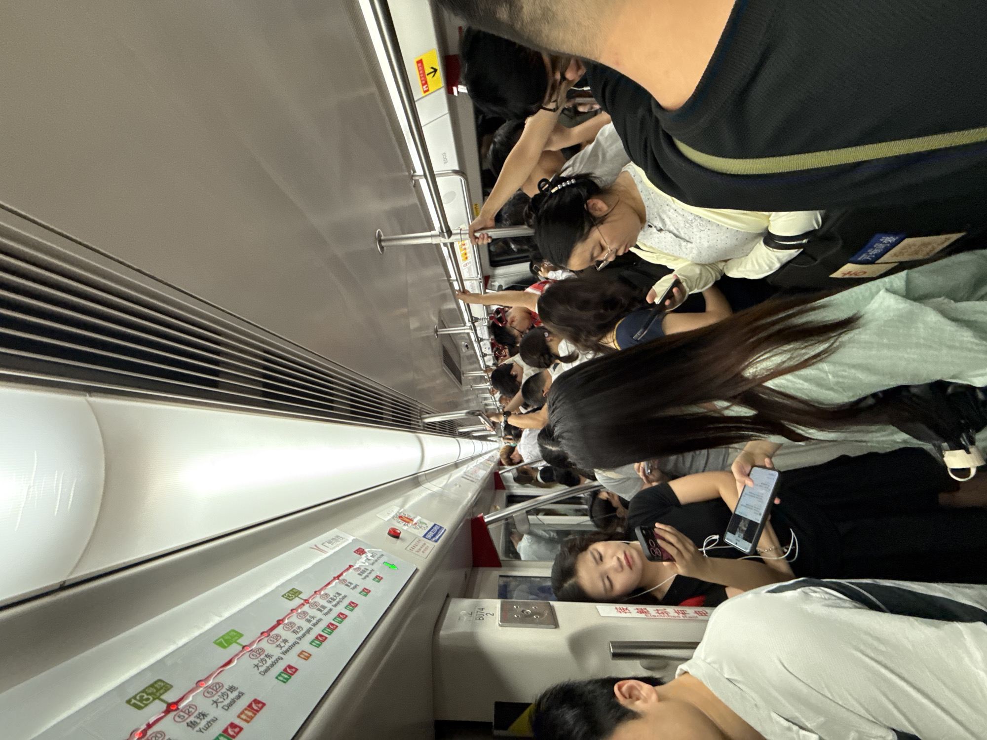 Crowded subway car documented in Tianhe District during peak hours