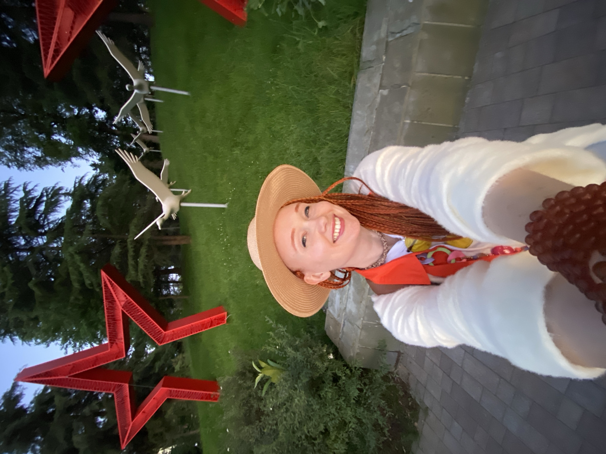 Woman takes selfies among roses in Sochi park