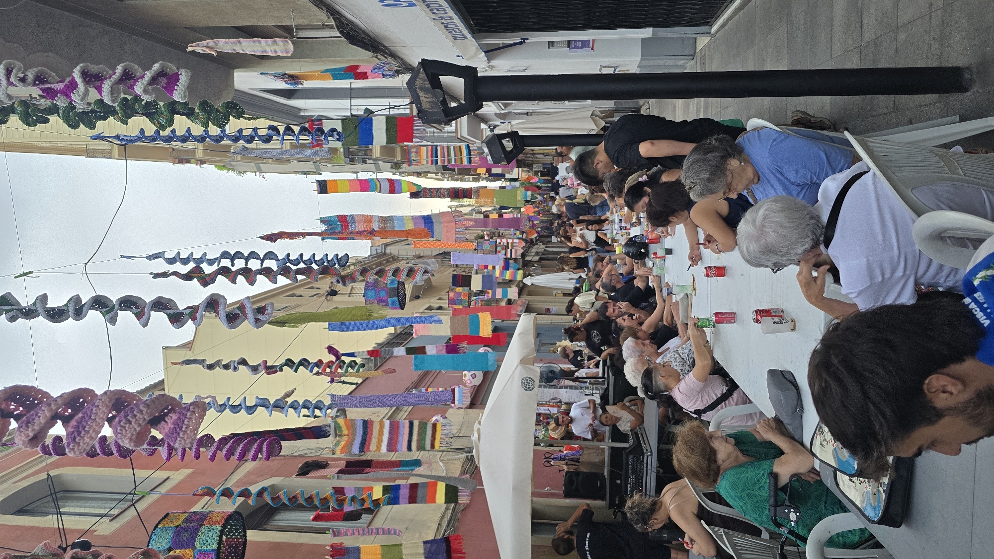 Barcelona neighborhood street festival with communal dining and folk art