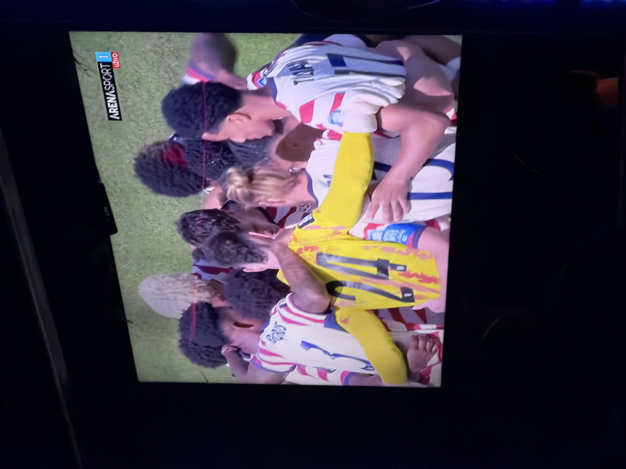 Soccer watch party at a neon-lit lounge in Travnik