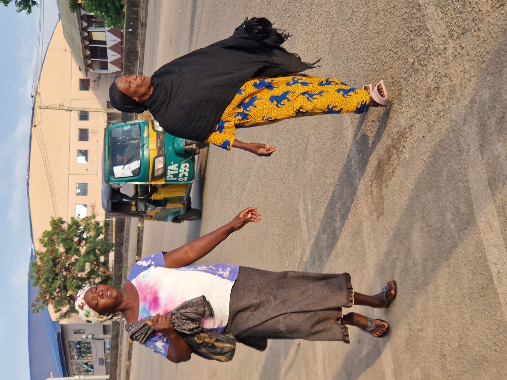 Morning street life in an African urban neighborhood