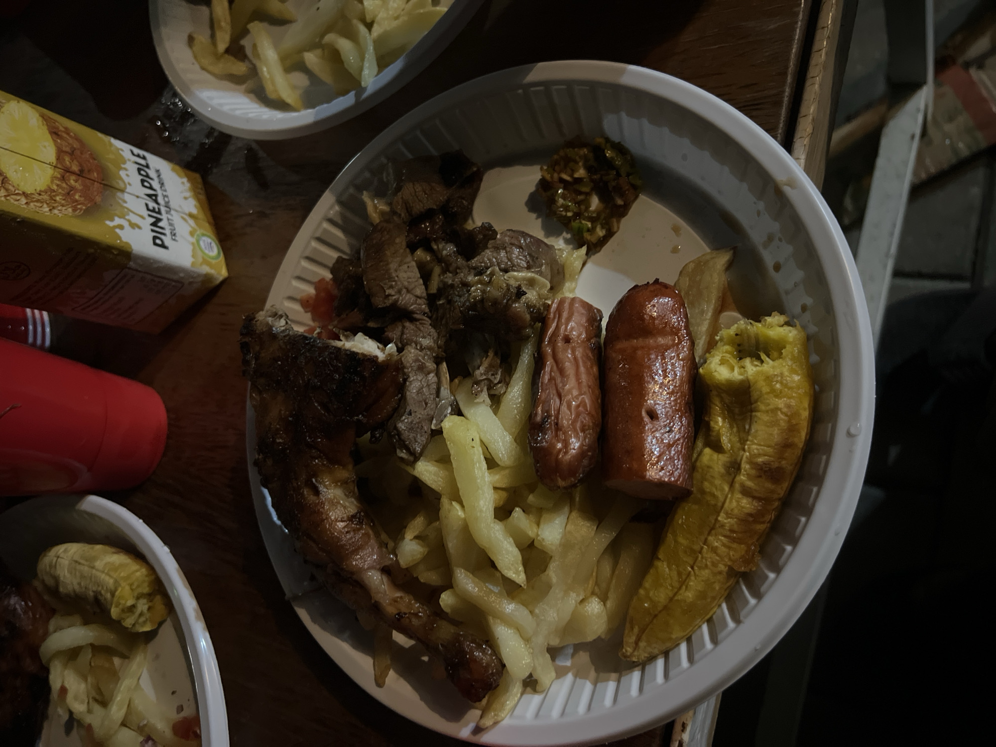 Mixed grill plate on a wooden table in Dar es Salaam