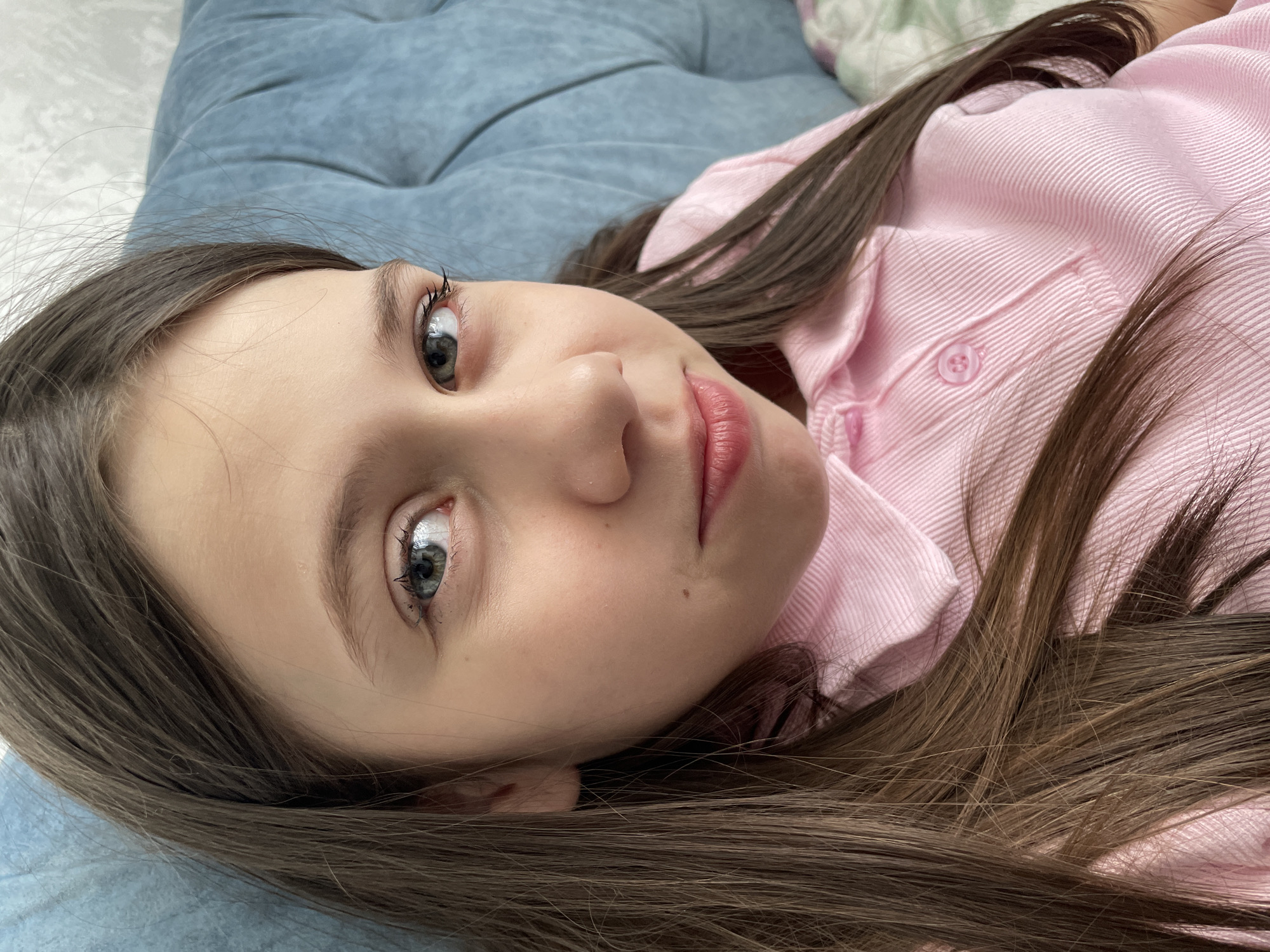 Young girl photographed resting indoors in Izhevsk
