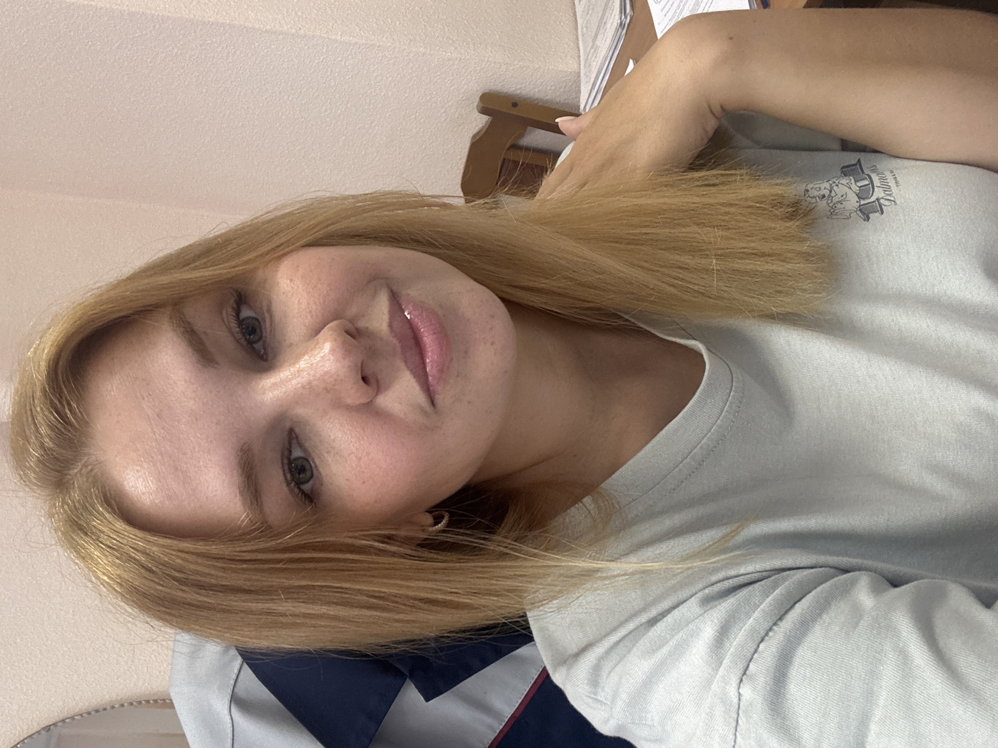 Office selfie session with a yellow smartphone